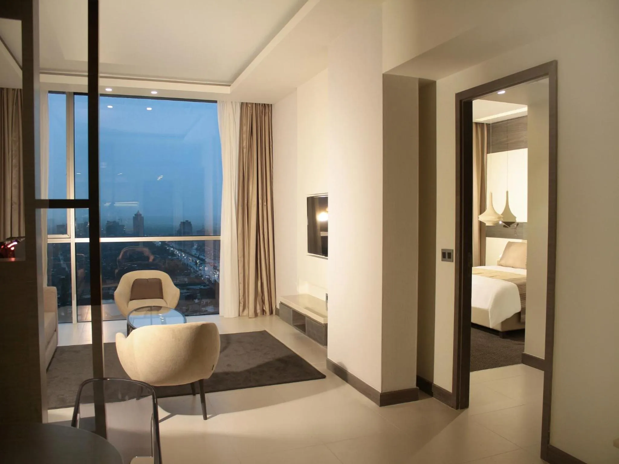 Living room, Bed in Erbil Arjaan by Rotana