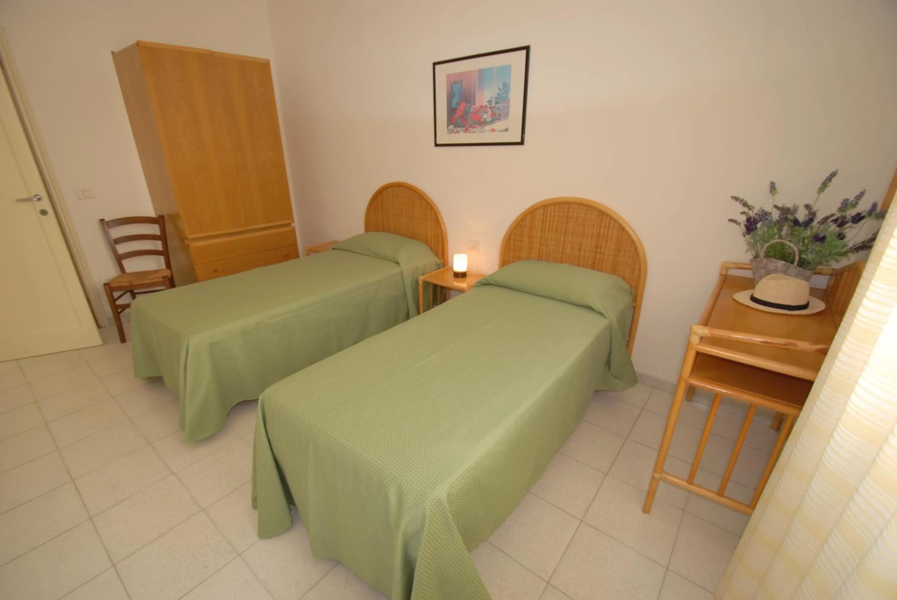 Bedroom in Appartamenti Olivo - 100 mt dal mare con aria condizionata