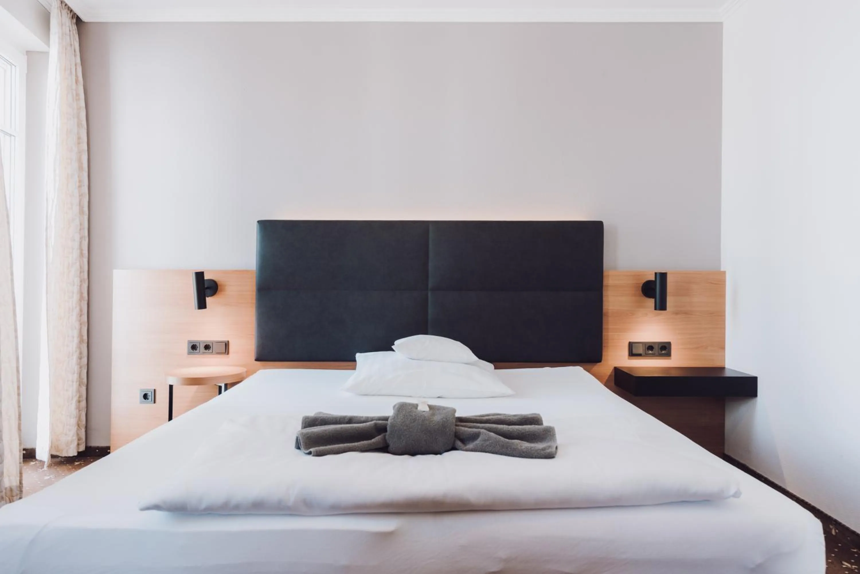 Bed in Ambienthotel Tassilo