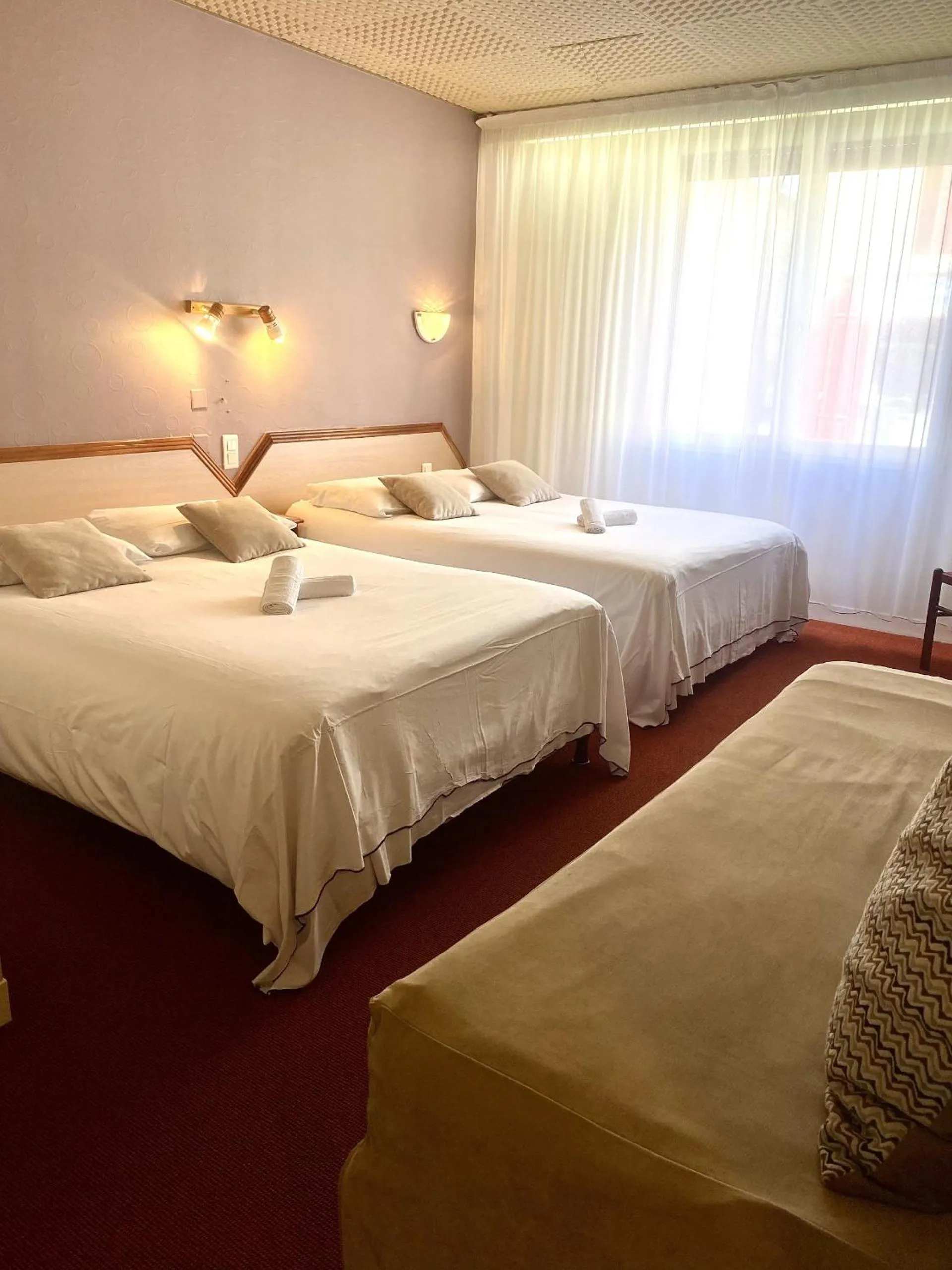 Photo of the whole room, Bed in Logis Hôtel & Restaurant Le Cheval Blanc et Clovis