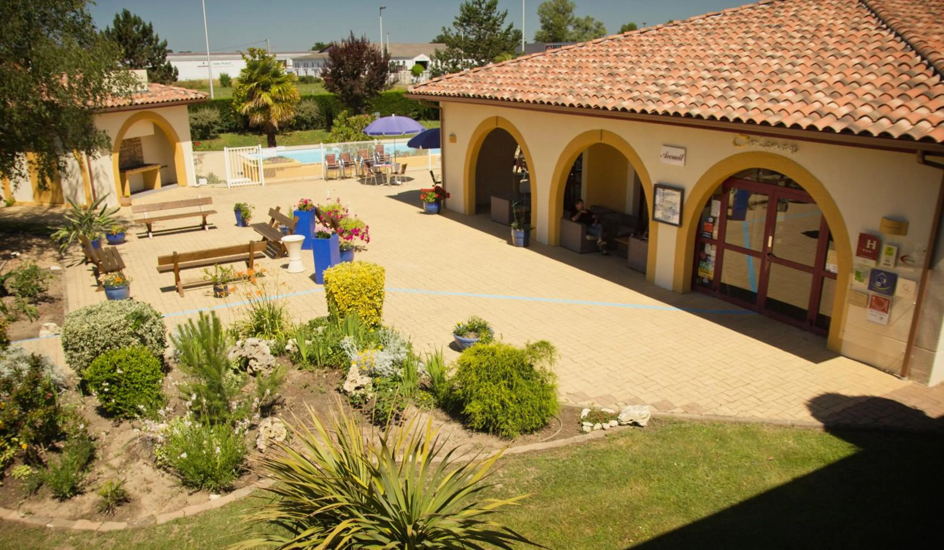 Garden in Logis Hôtel Restaurant Solenca