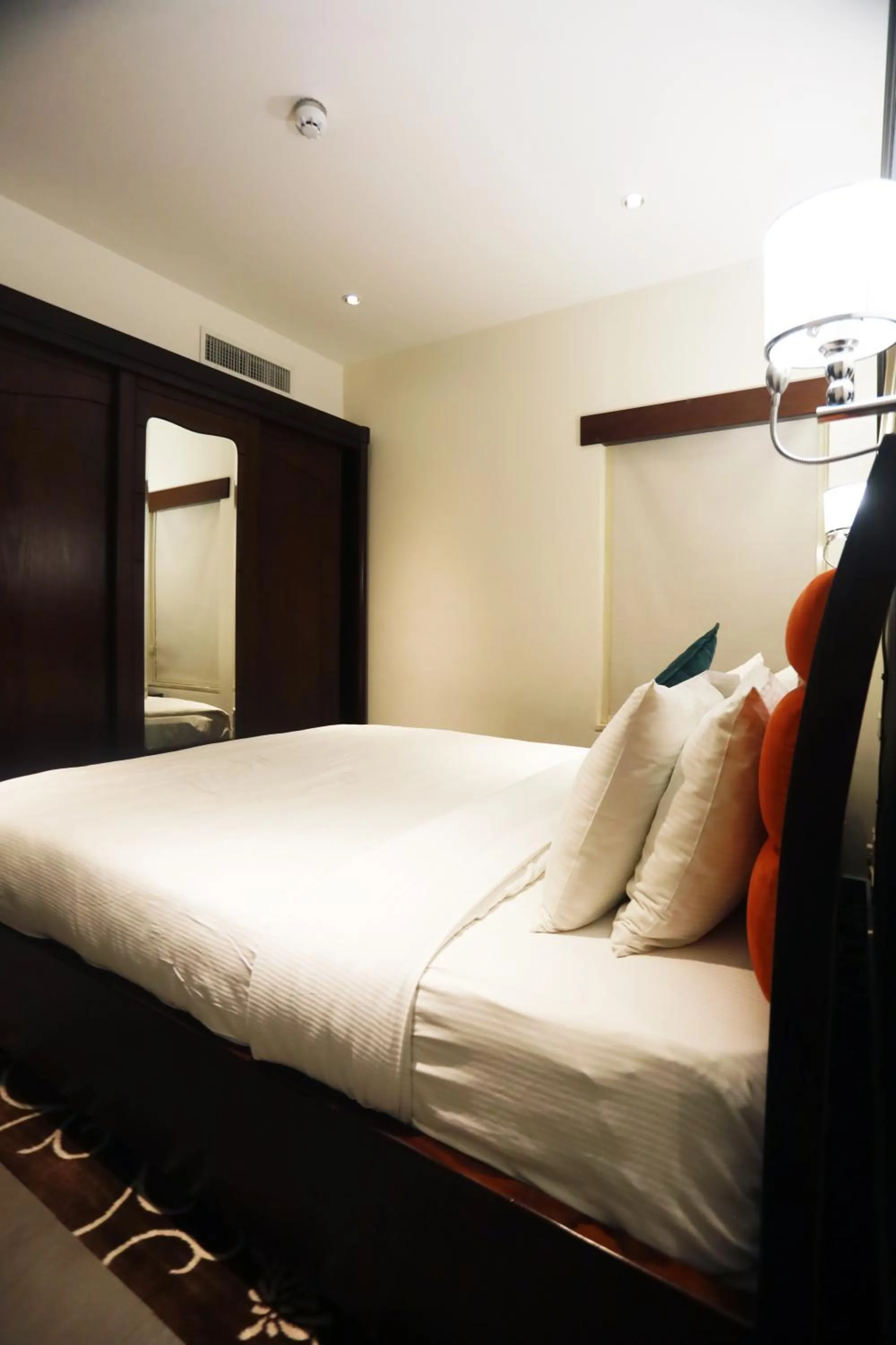 Bed in Naylover Hotel Suites