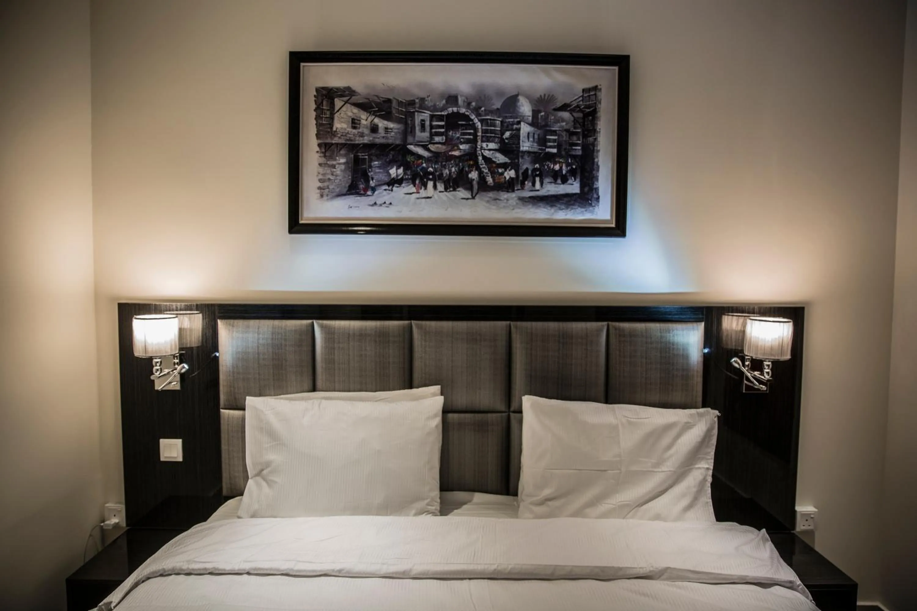 Bed in Naylover Hotel Suites