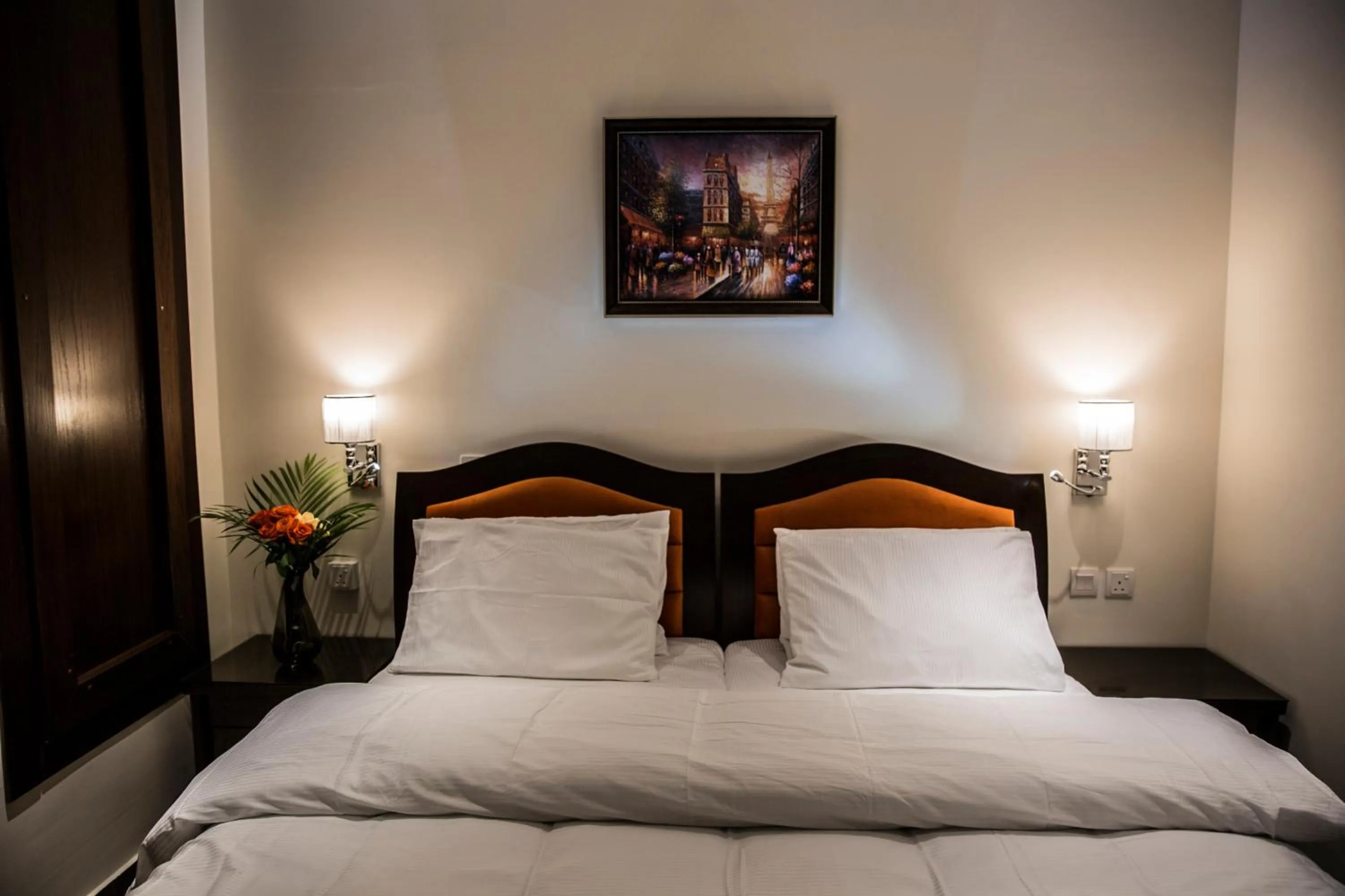 Bed in Naylover Hotel Suites