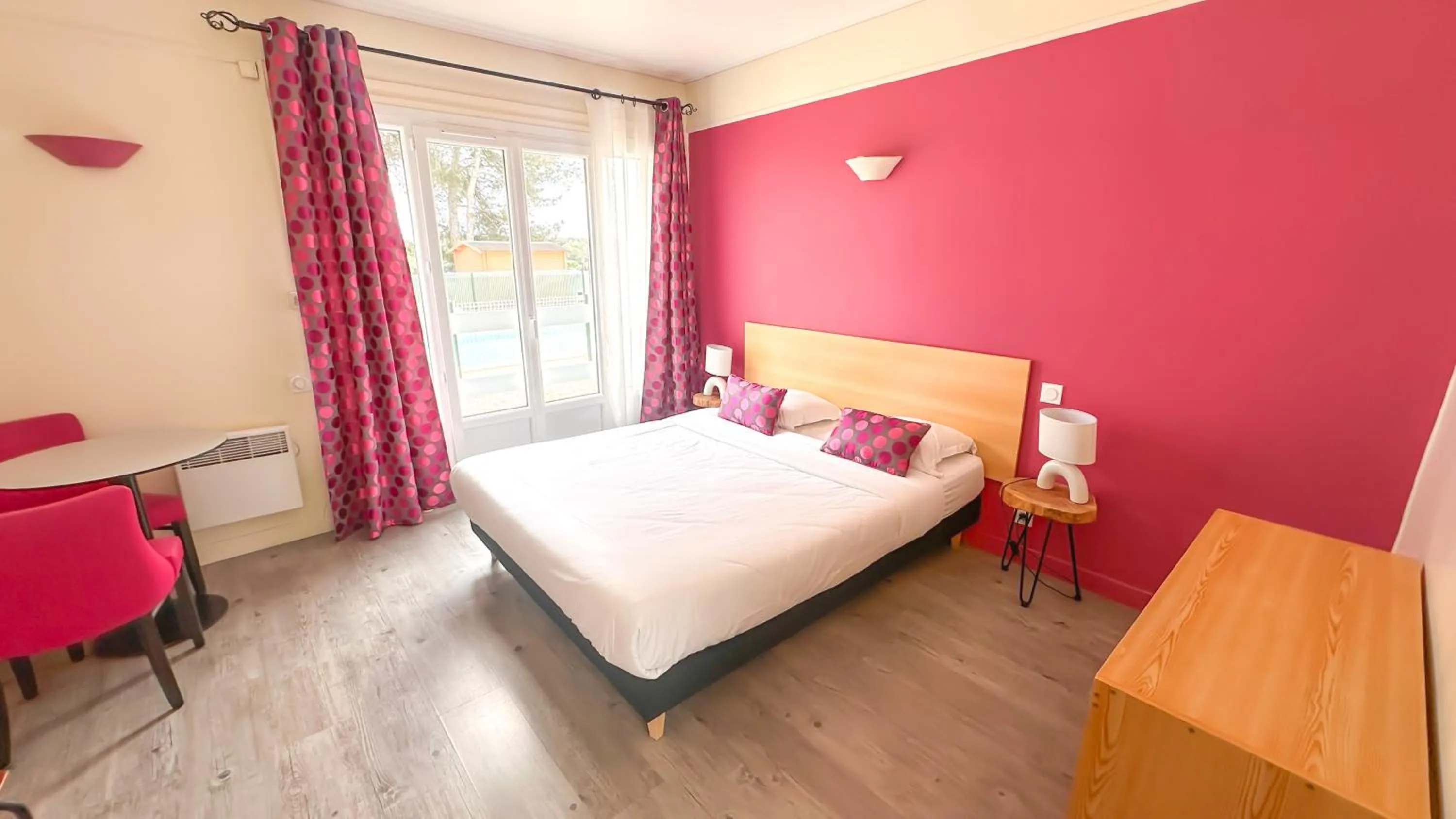 Seating area, Bed in Hotel Les Rocailles