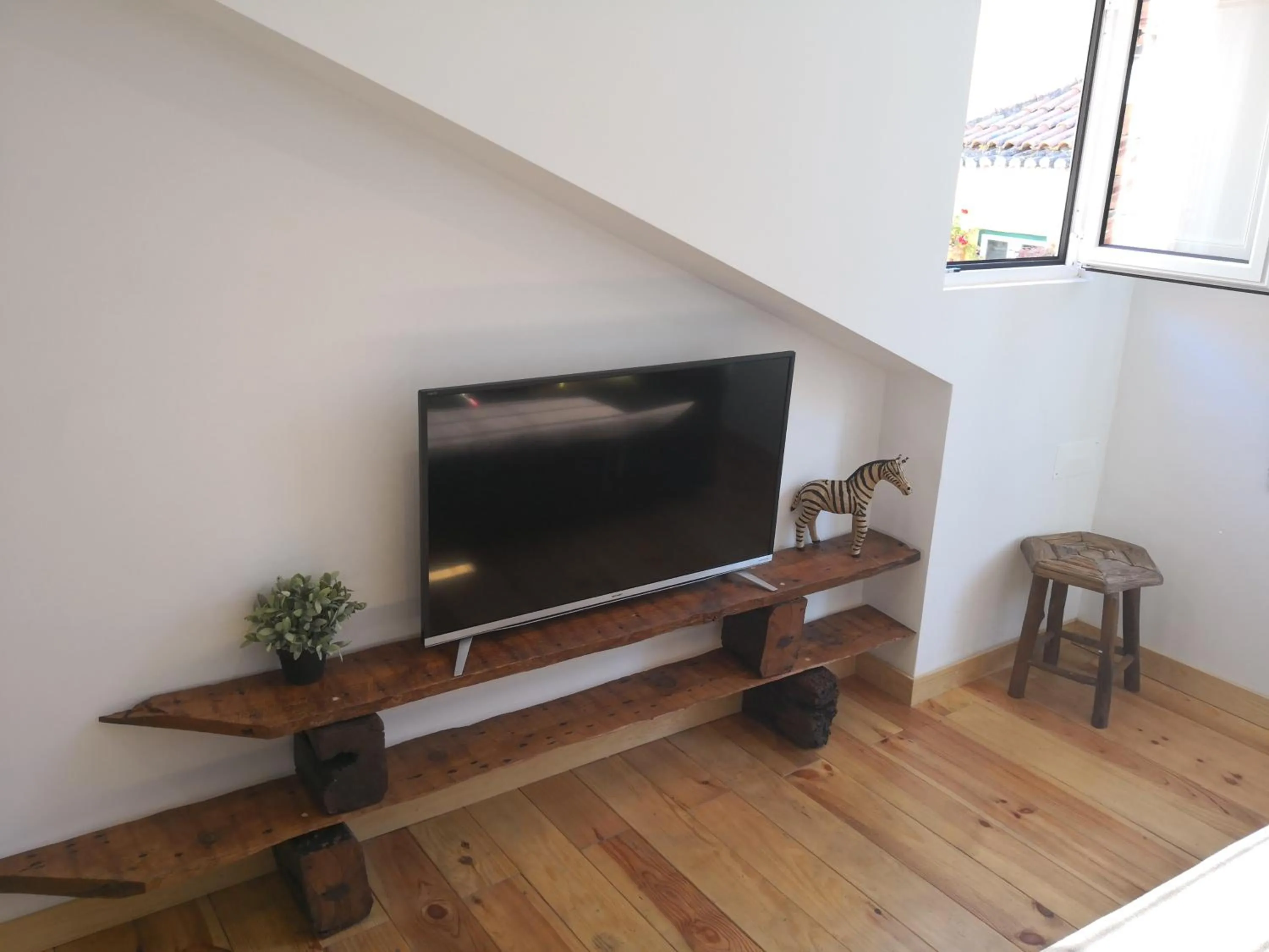 Communal lounge/ TV room in BairroSweethome