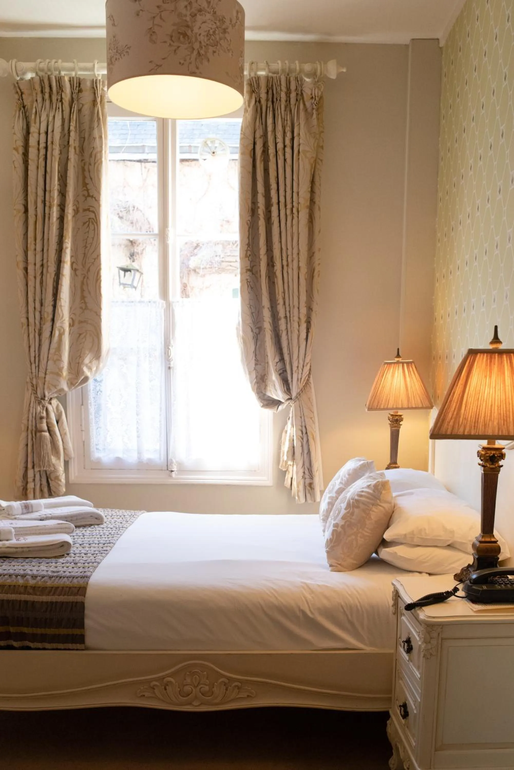 Bed in Logis Hotel De France