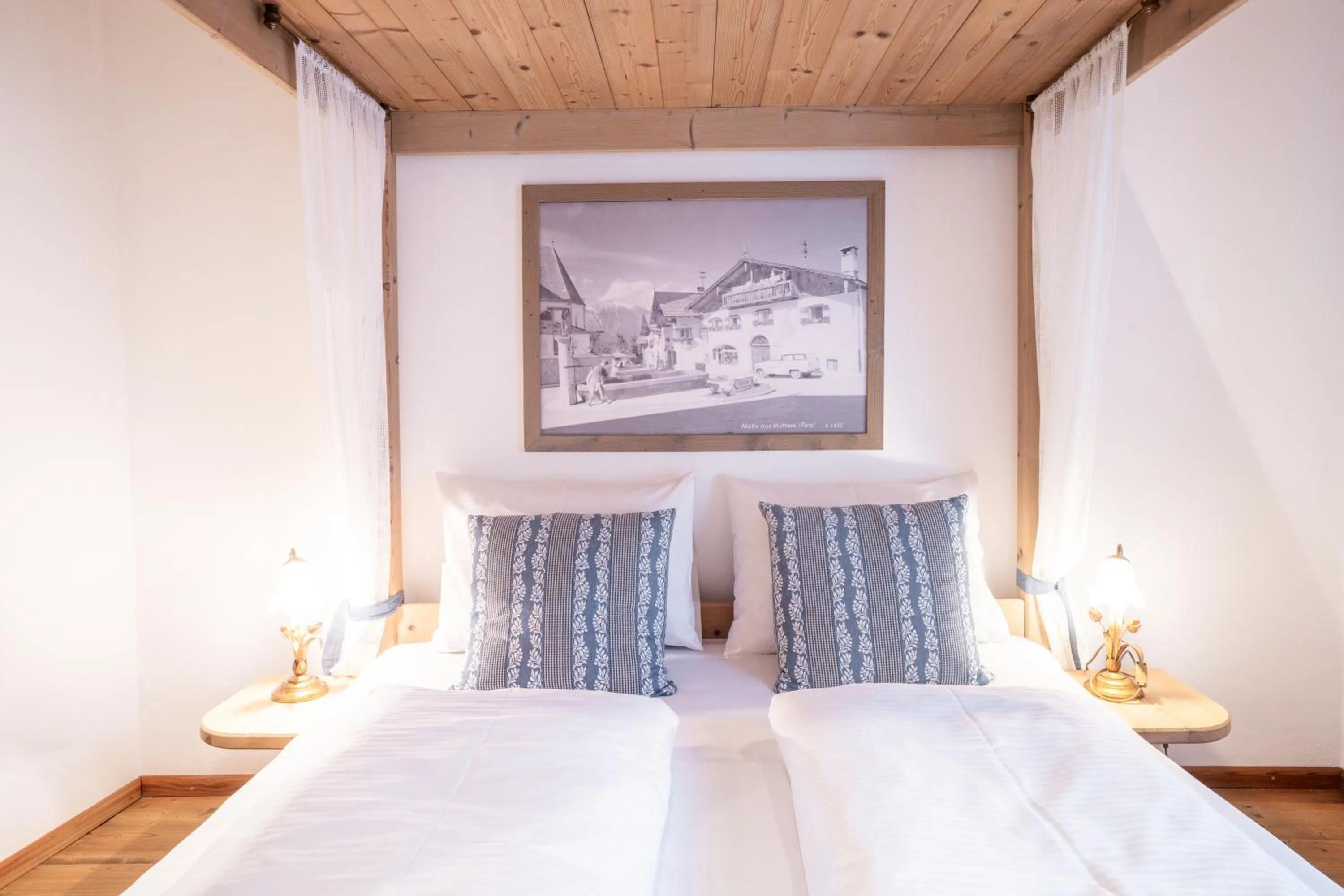 Bed in Stauders Zimmer und Ferienwohnungen