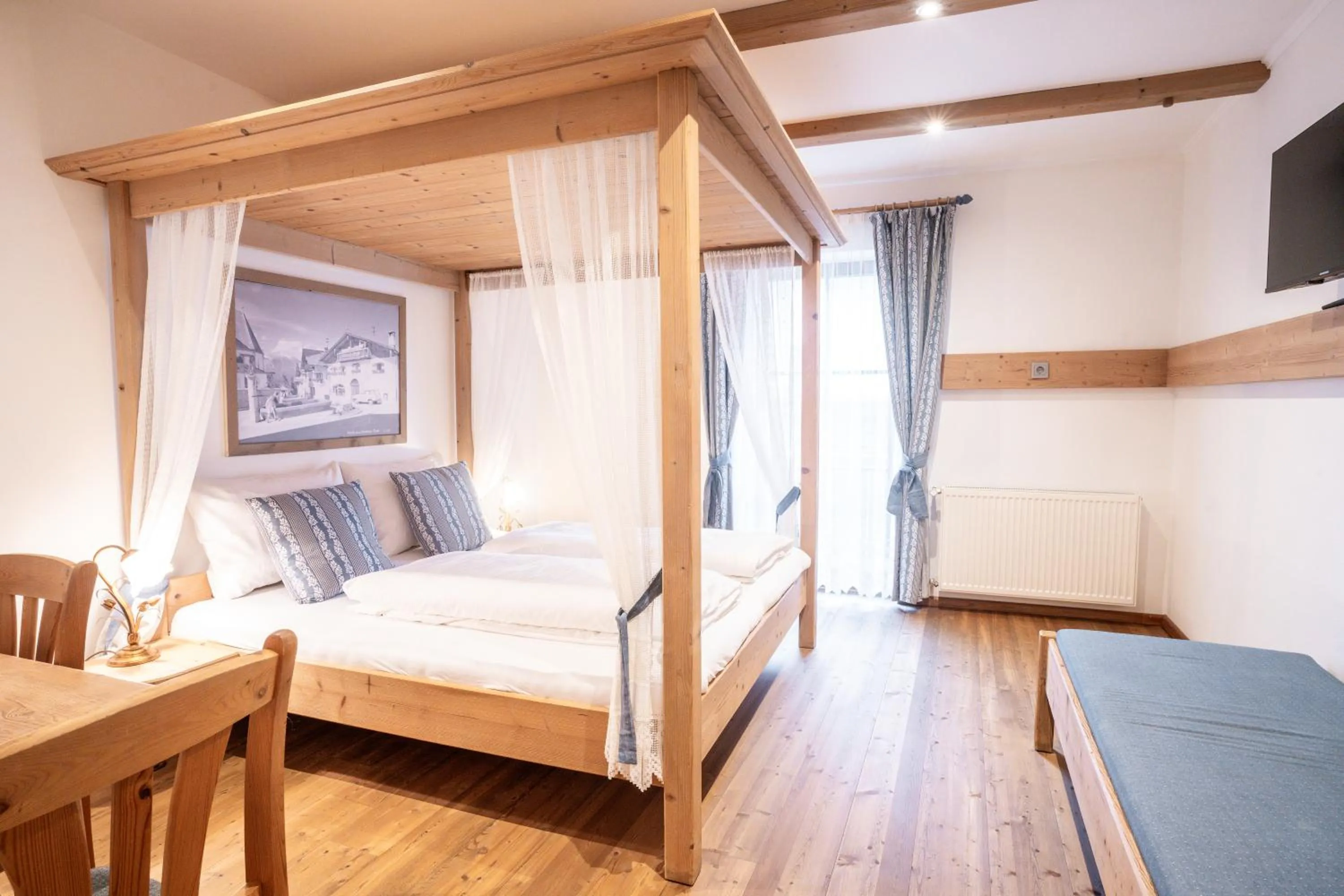 Bed in Stauders Zimmer und Ferienwohnungen