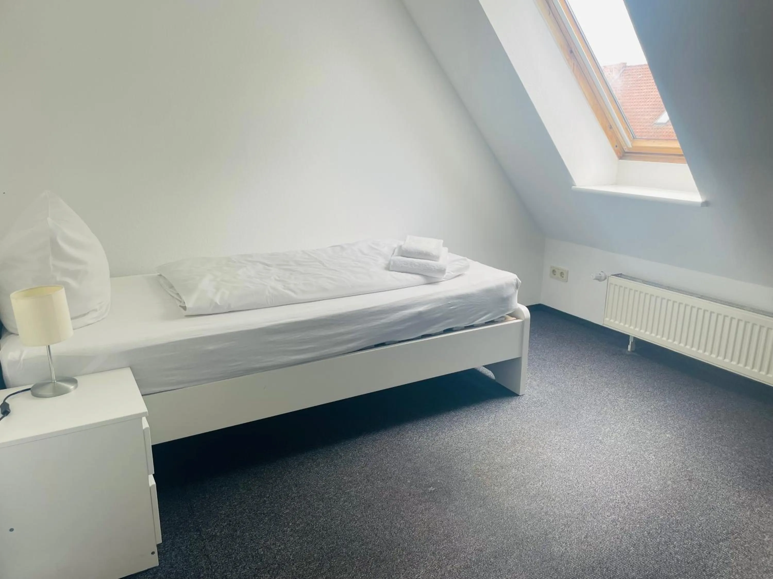 Bed in MARKT EINS Gästezimmer