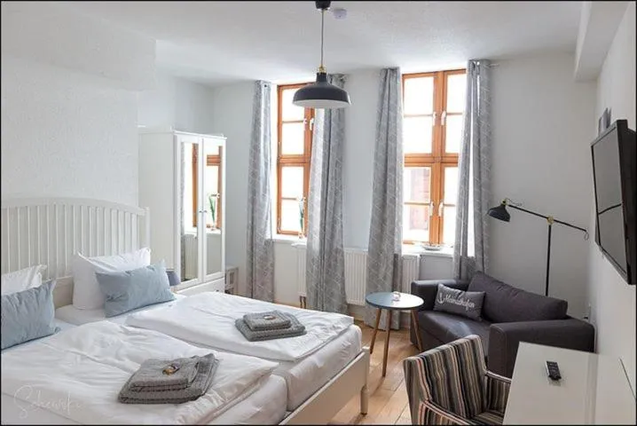 Bed in MARKT EINS Gästezimmer