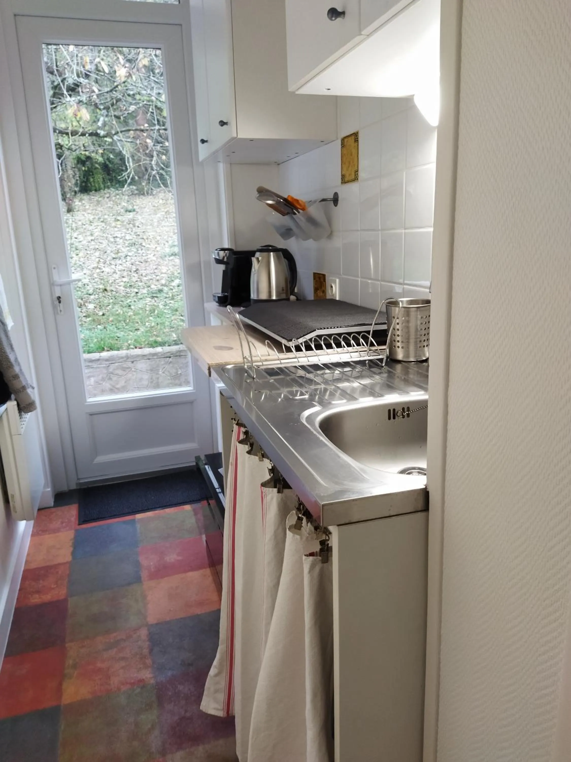 Kitchen or kitchenette in Appartements Les remparts d'Alienor