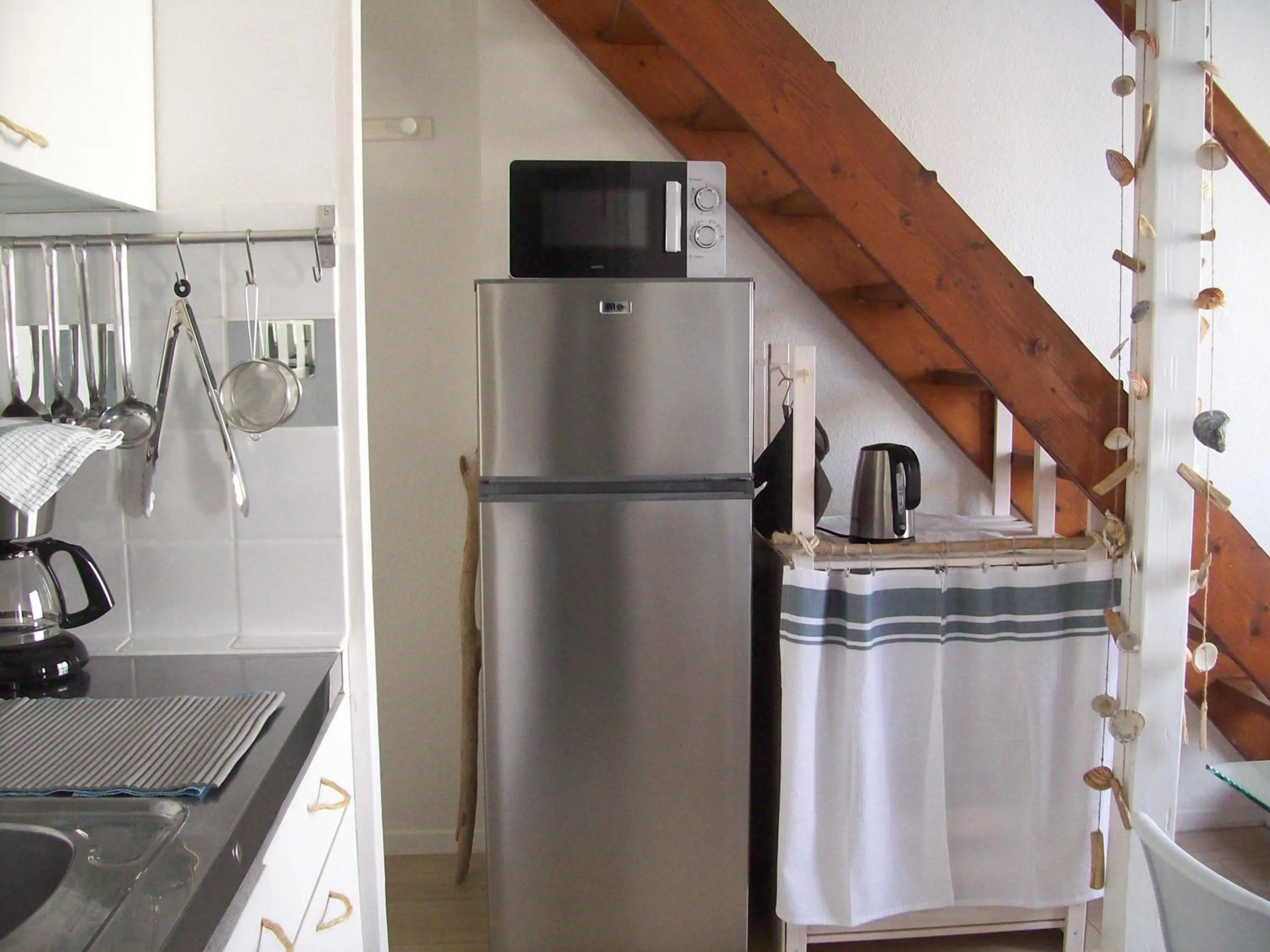 Kitchen or kitchenette in Appartements Les remparts d'Alienor