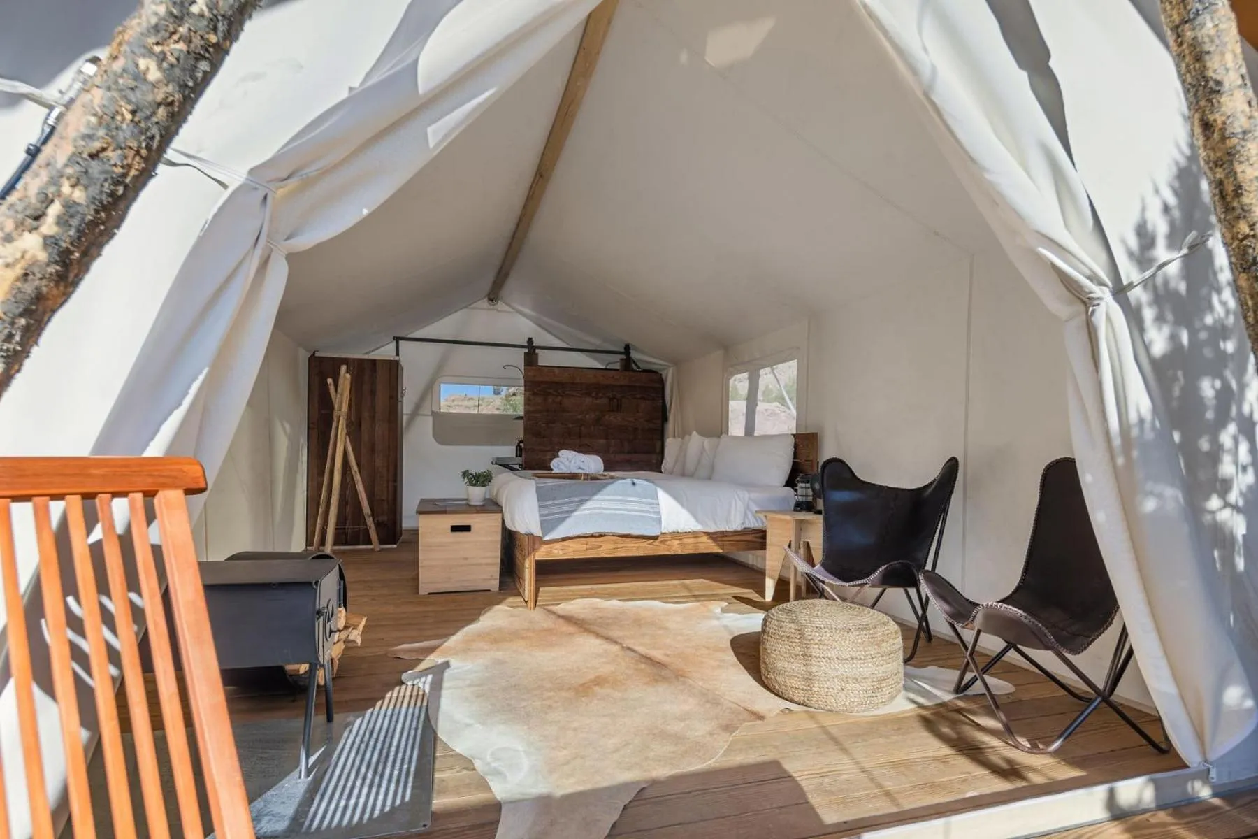 Seating area, Bed in Under Canvas Zion