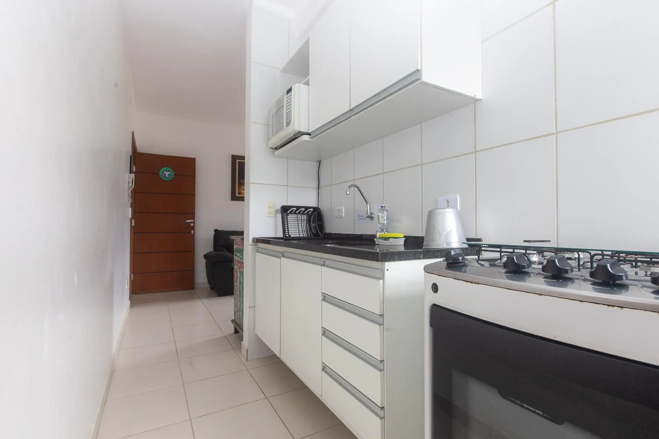 kitchen in Apartamento Erica Itaguá proximo da Praia Grande