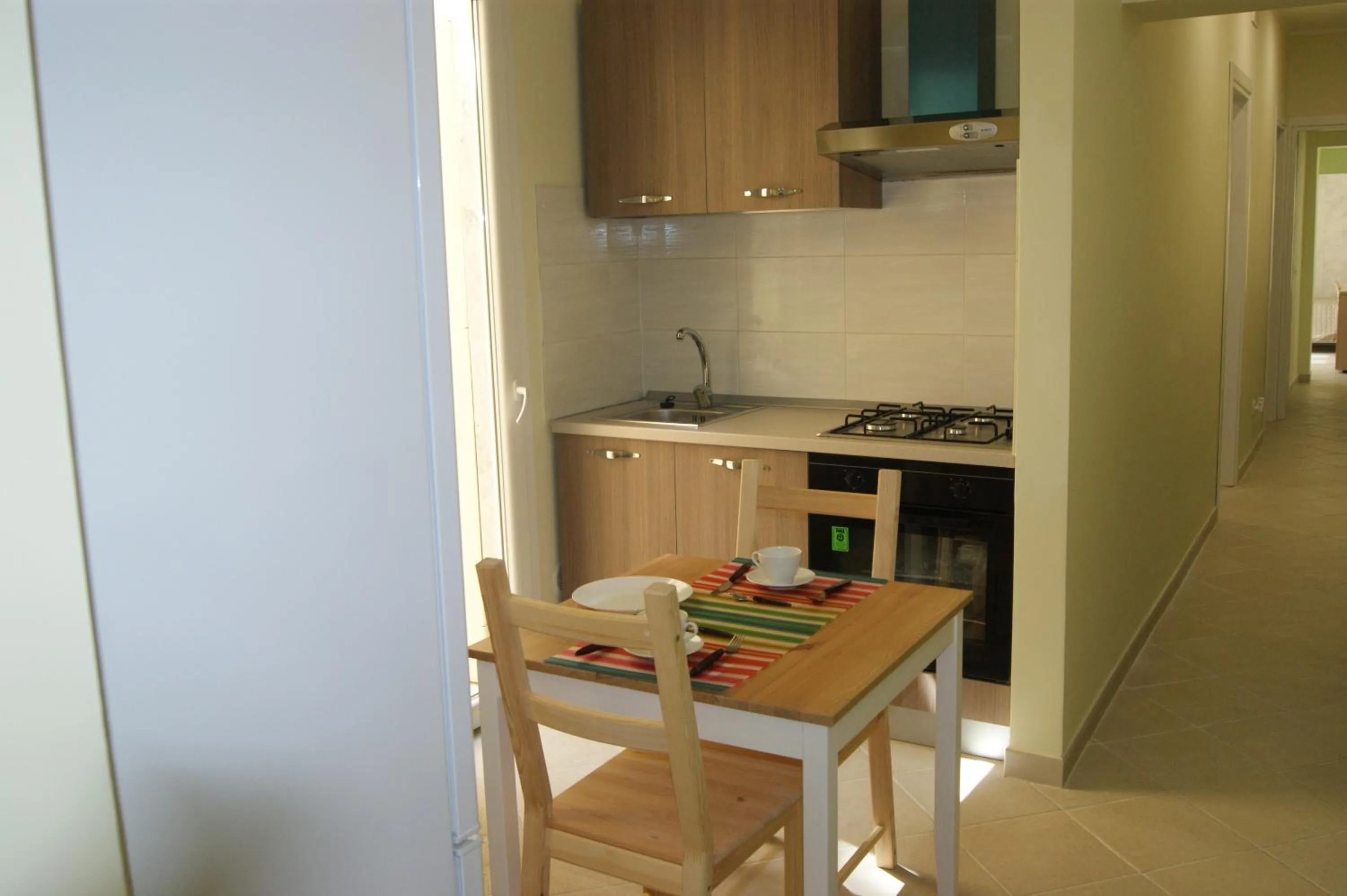 Communal kitchen in Guest House Golfo Xifonio