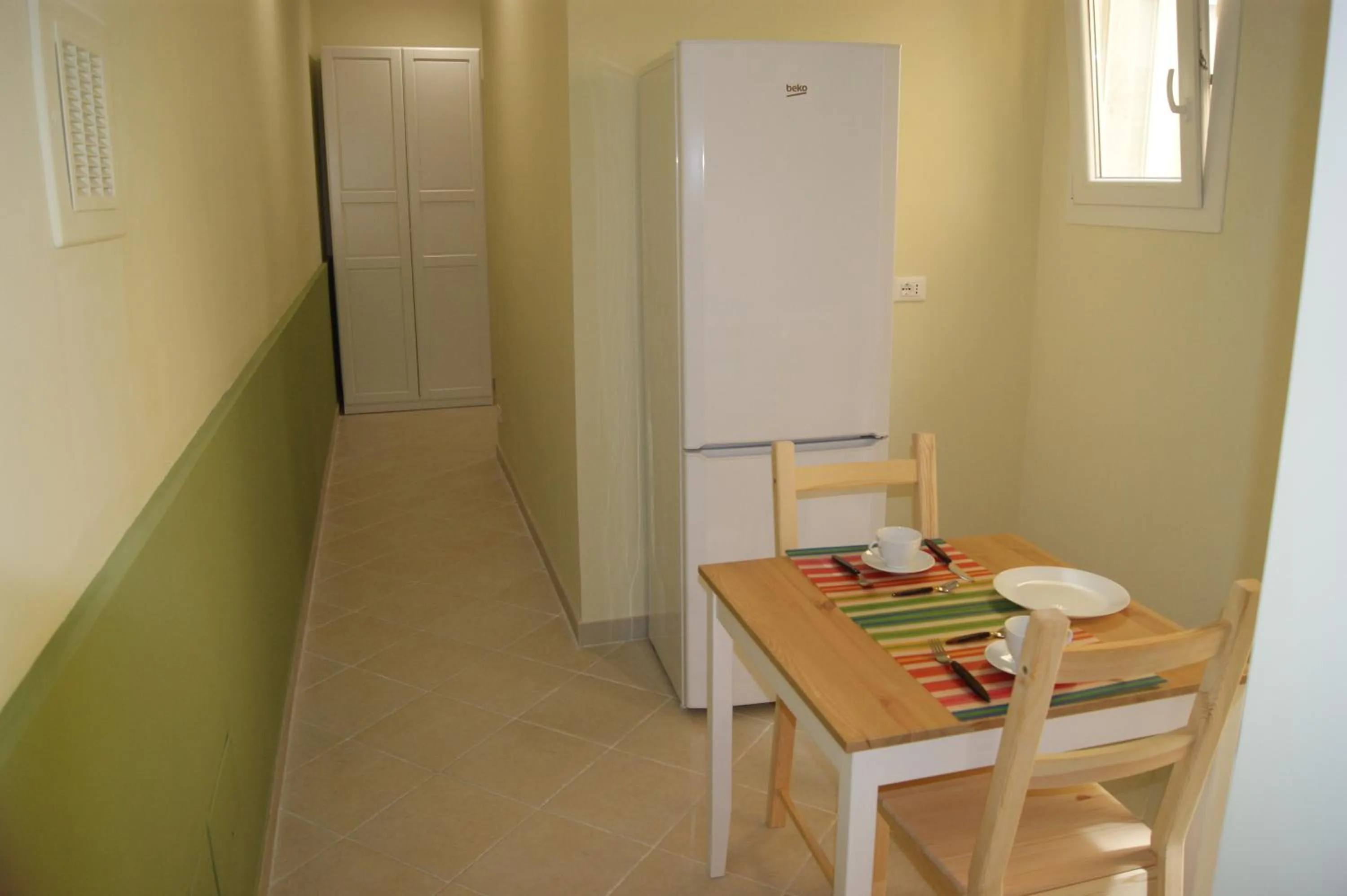 Communal kitchen in Guest House Golfo Xifonio