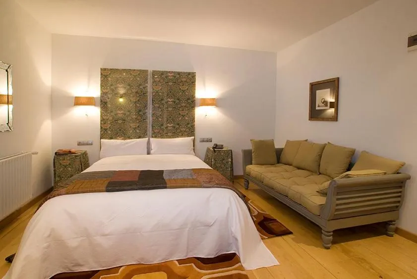 Bed in Hotel y apartamentos rurales L'Anceo