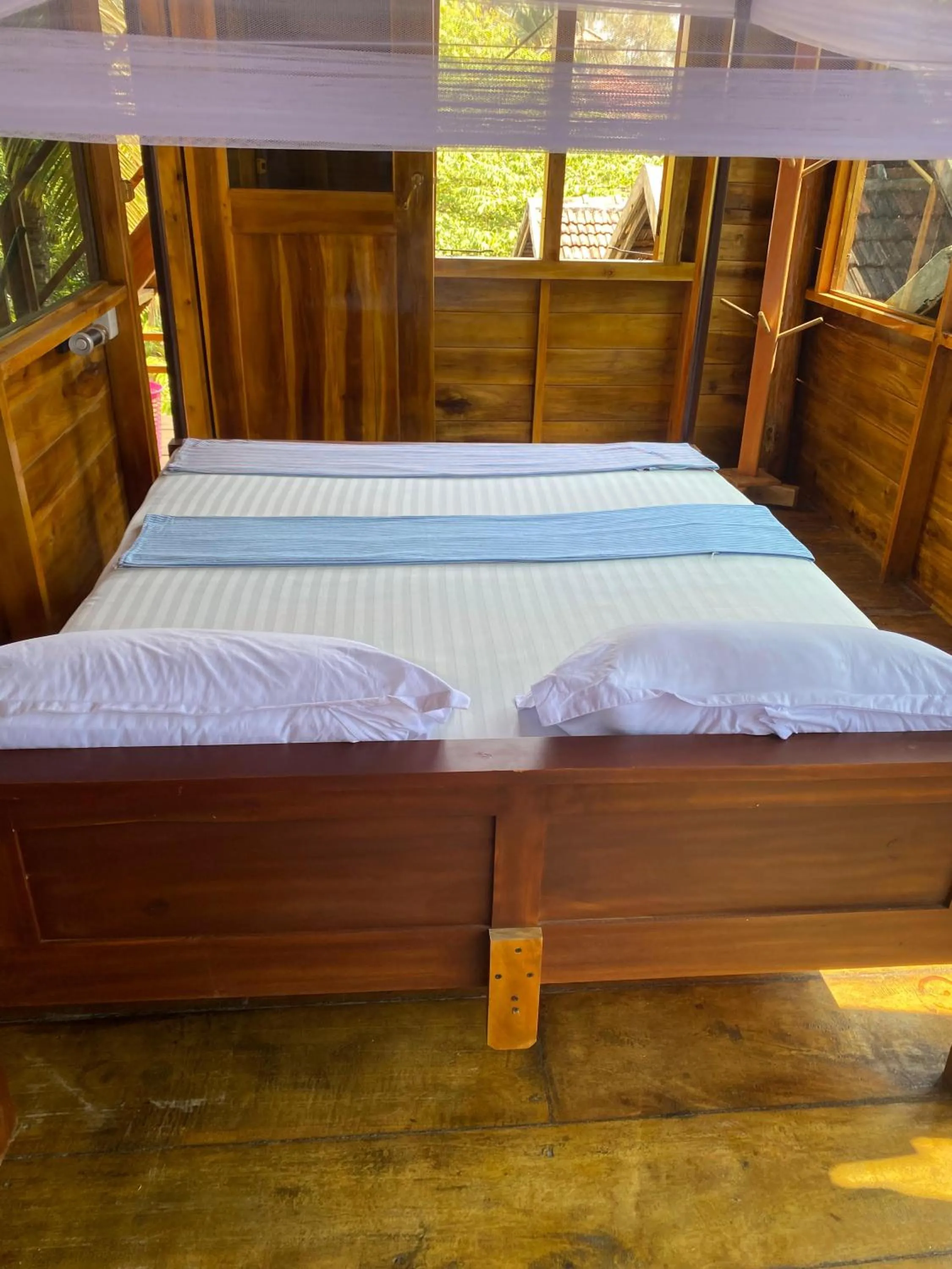 Bed in Surf Beach Hotel