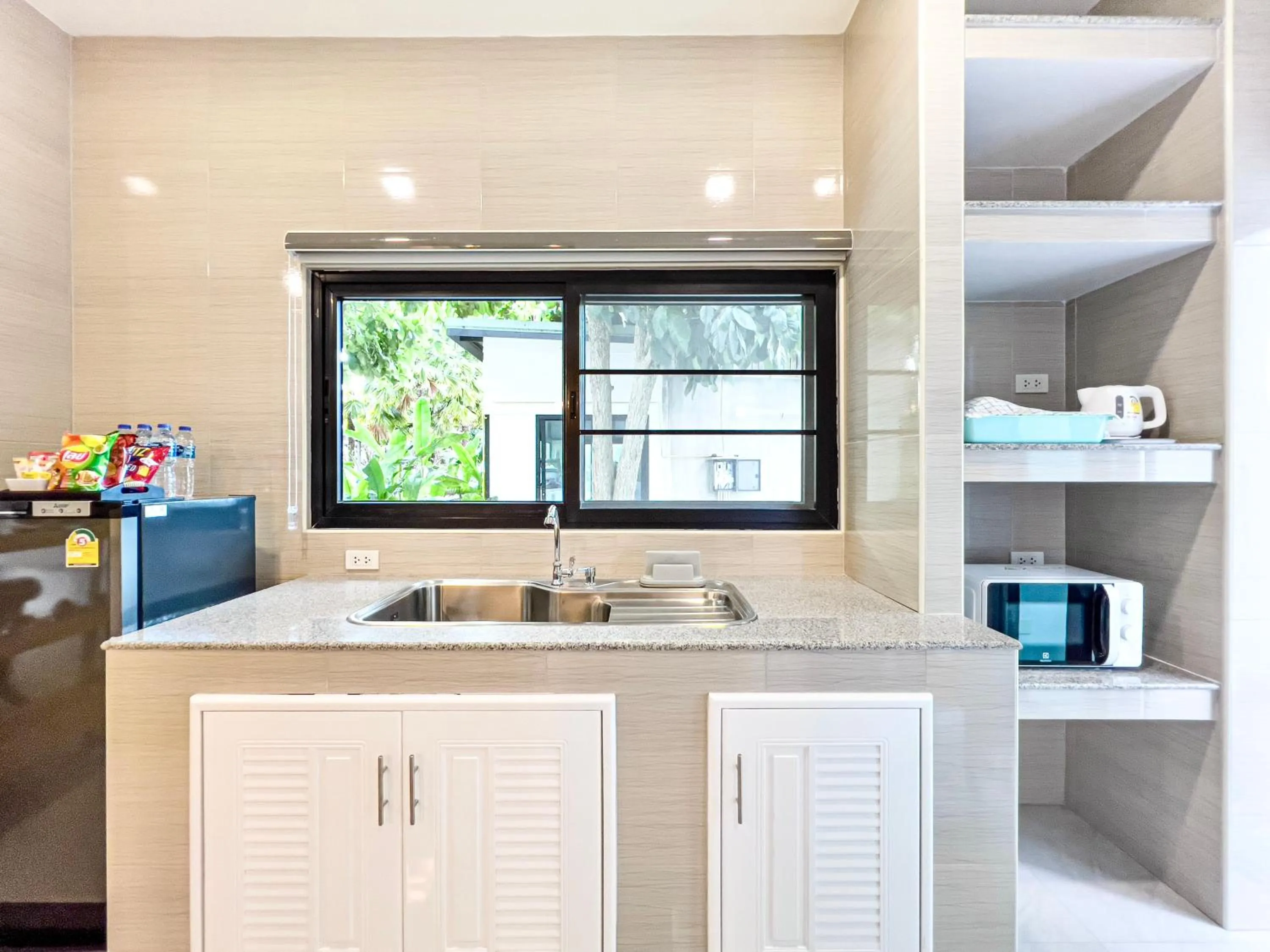 Kitchen or kitchenette in Chez Bure - Bure Homestay