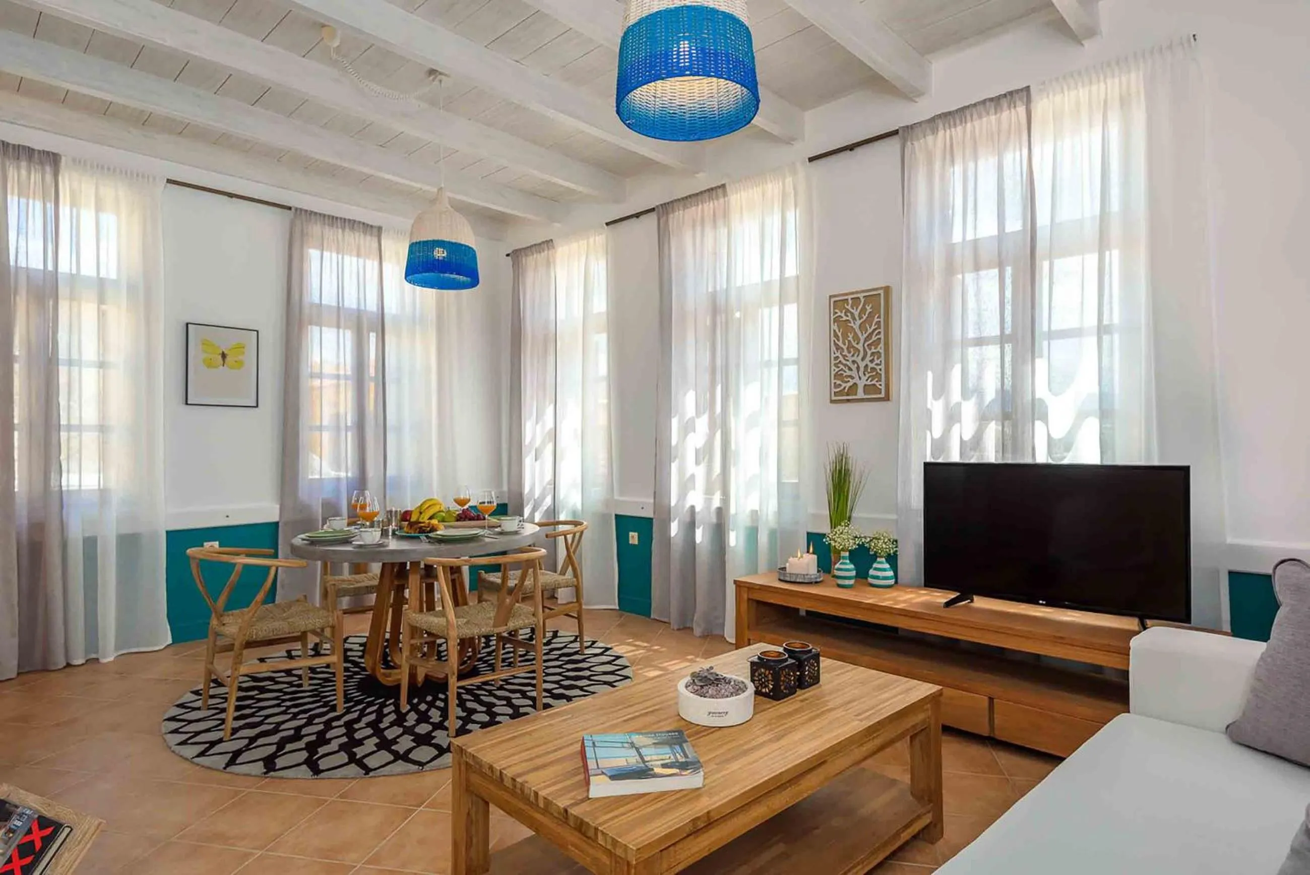 TV and multimedia in Lithinon Luxury Suites with Free Parking