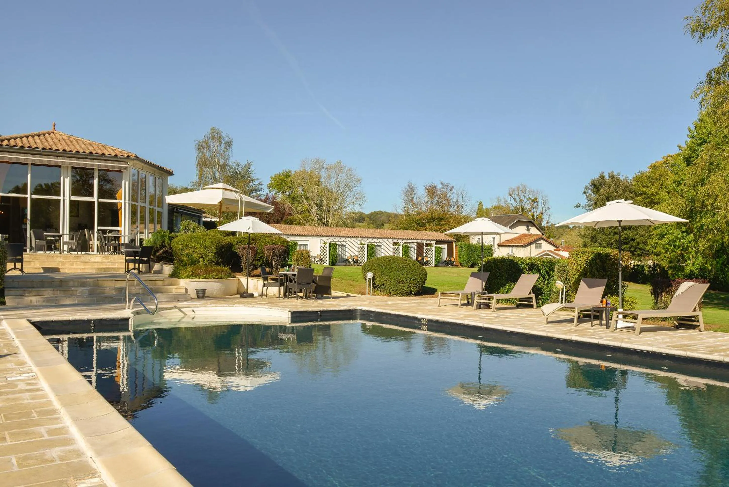 Swimming pool in Logis Hôtel Val de Vienne