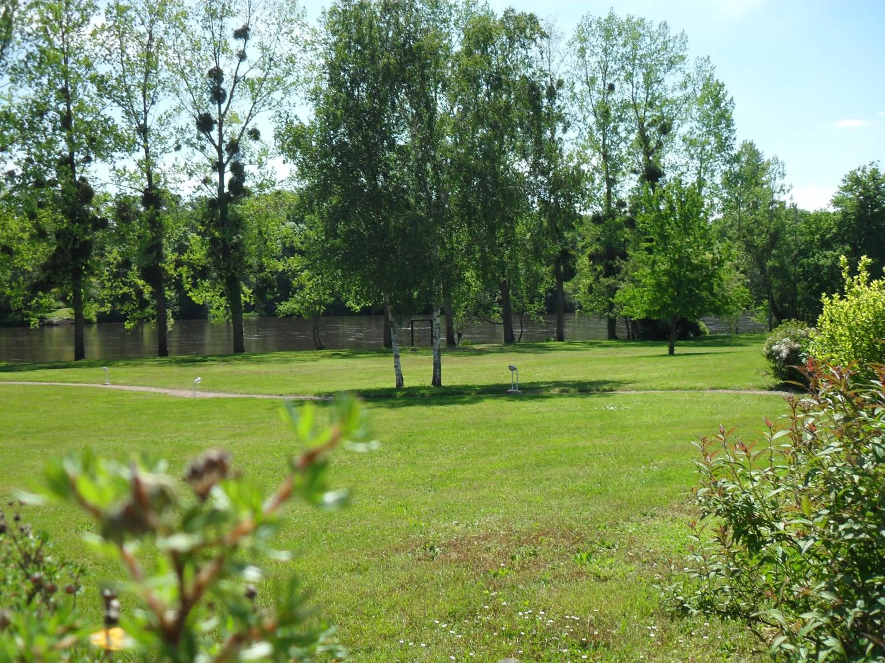 Garden view in Logis Hôtel Val de Vienne