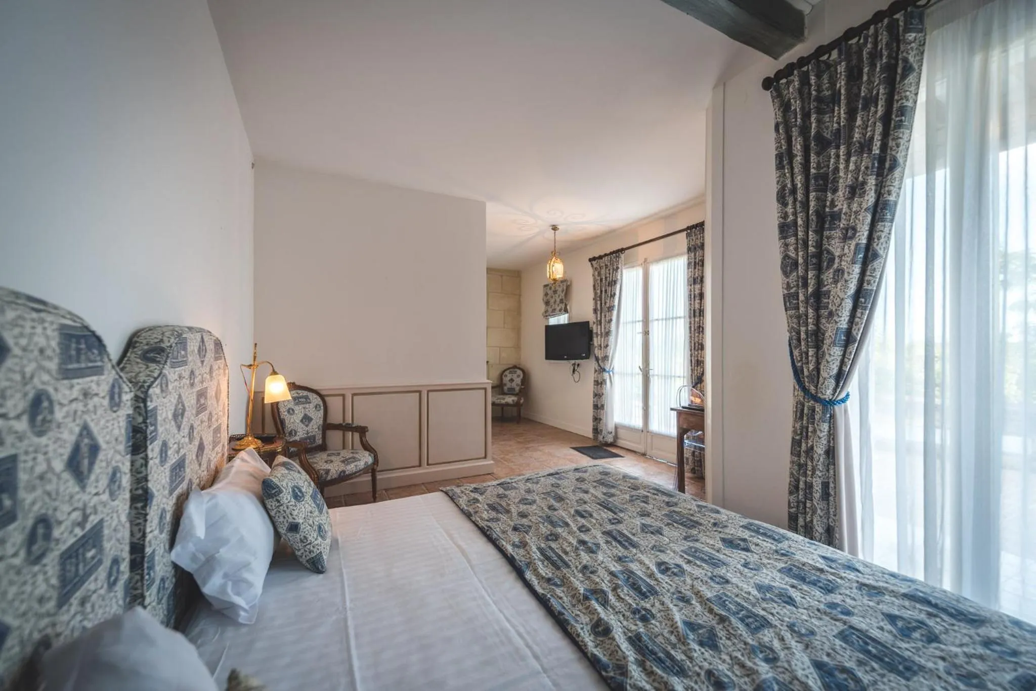 Bed in Logis Demeure de la Vignole