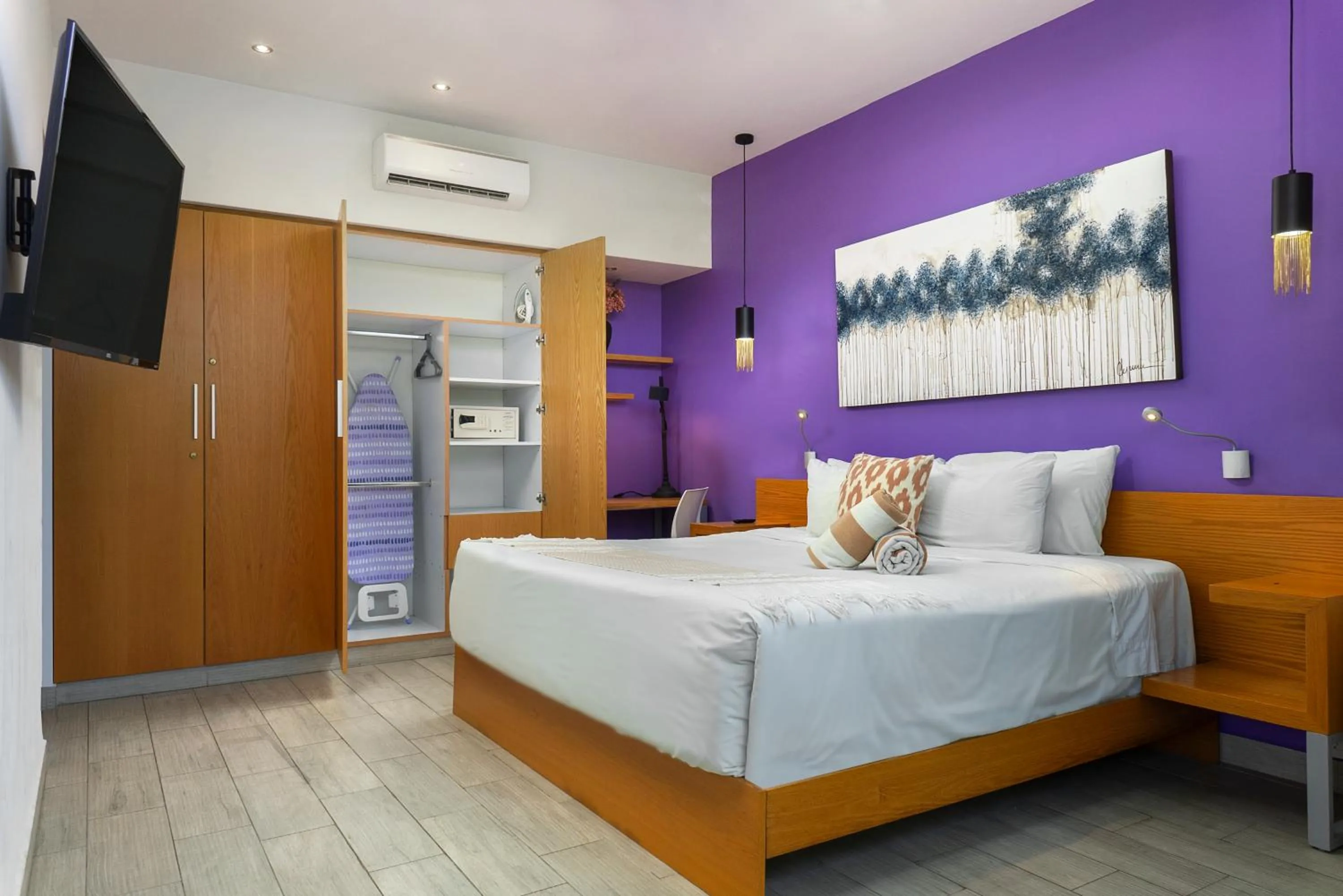 Bed in Opal Suites Apartments