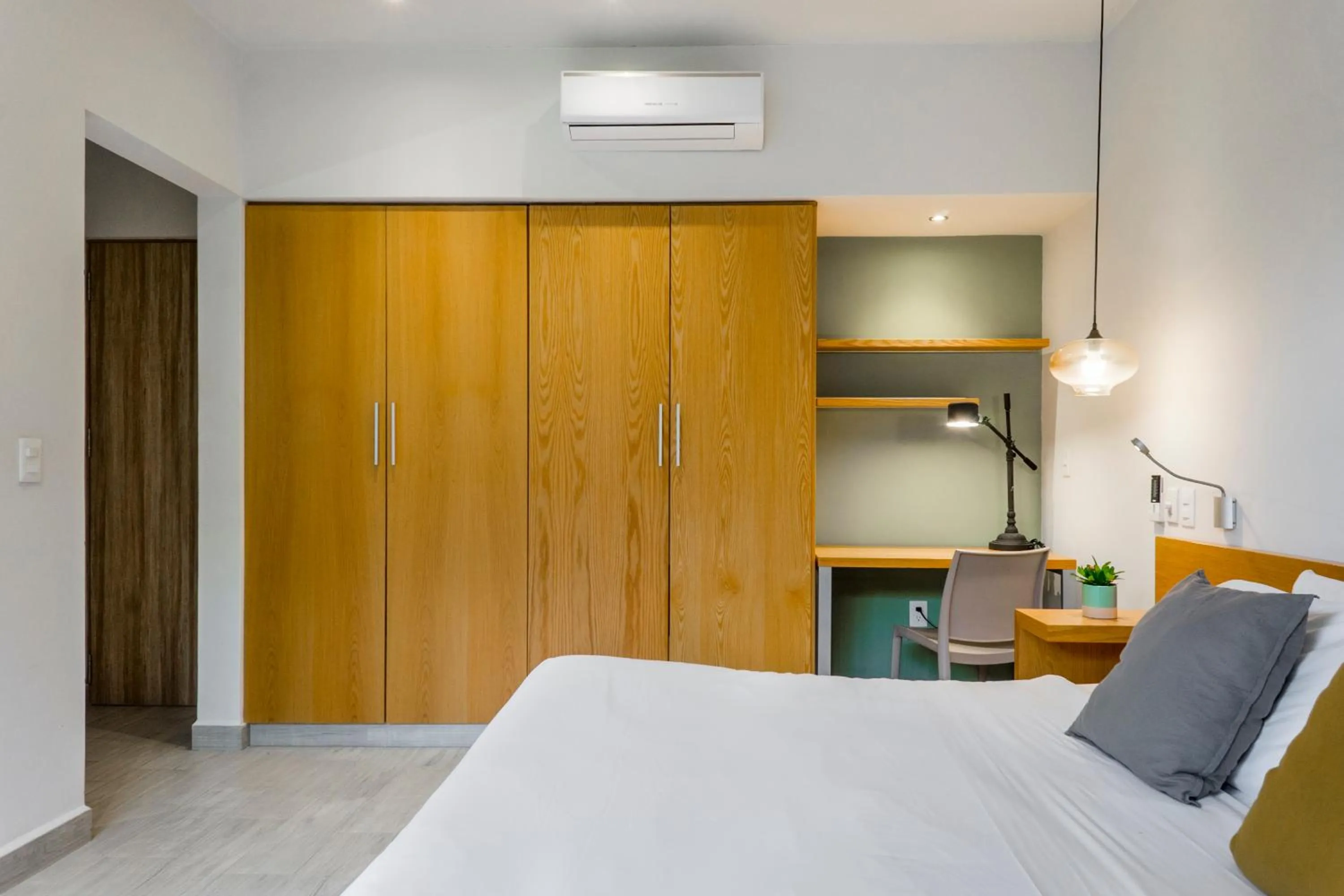 Bed in Opal Suites Apartments