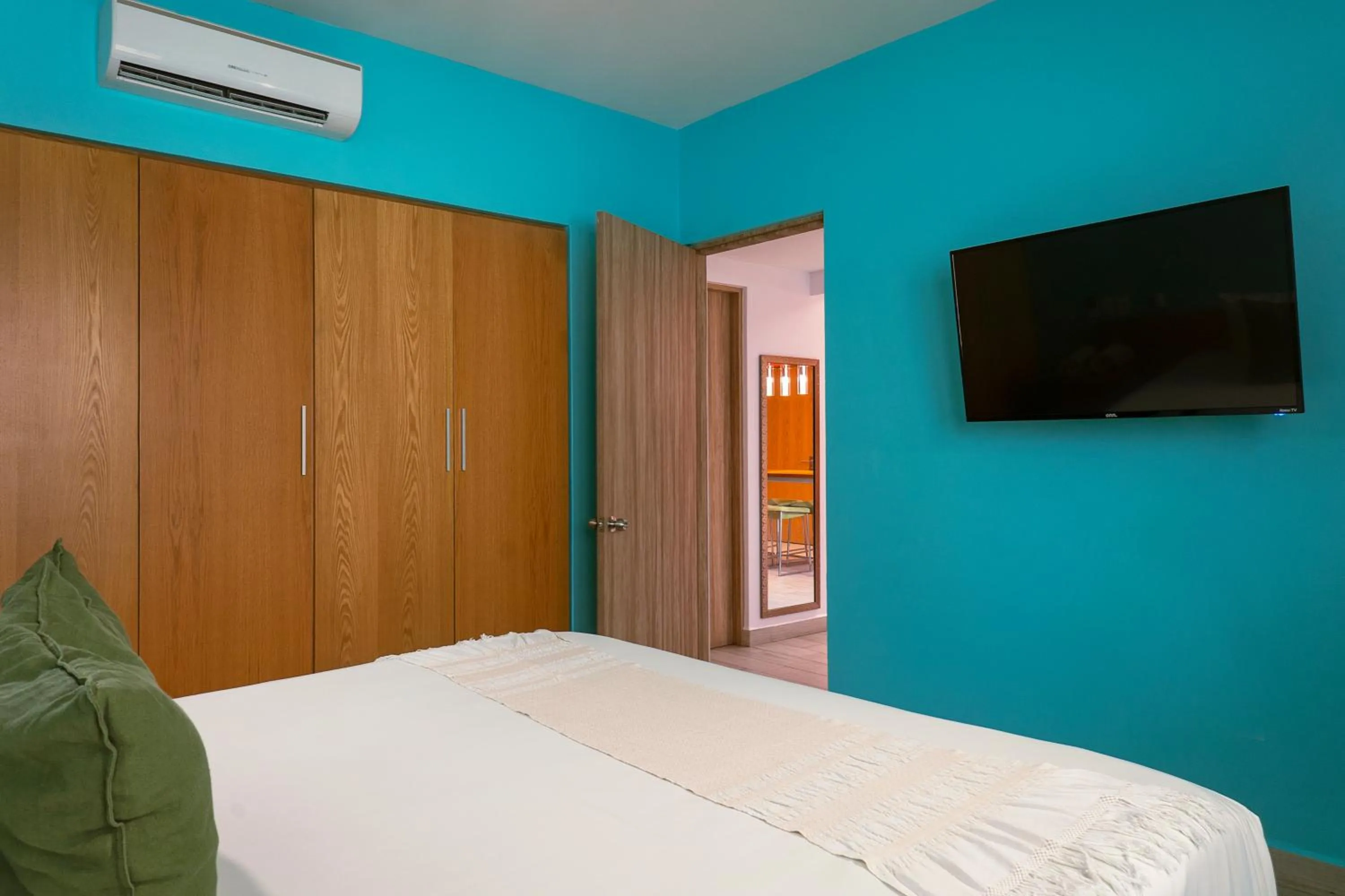 Bed in Opal Suites Apartments