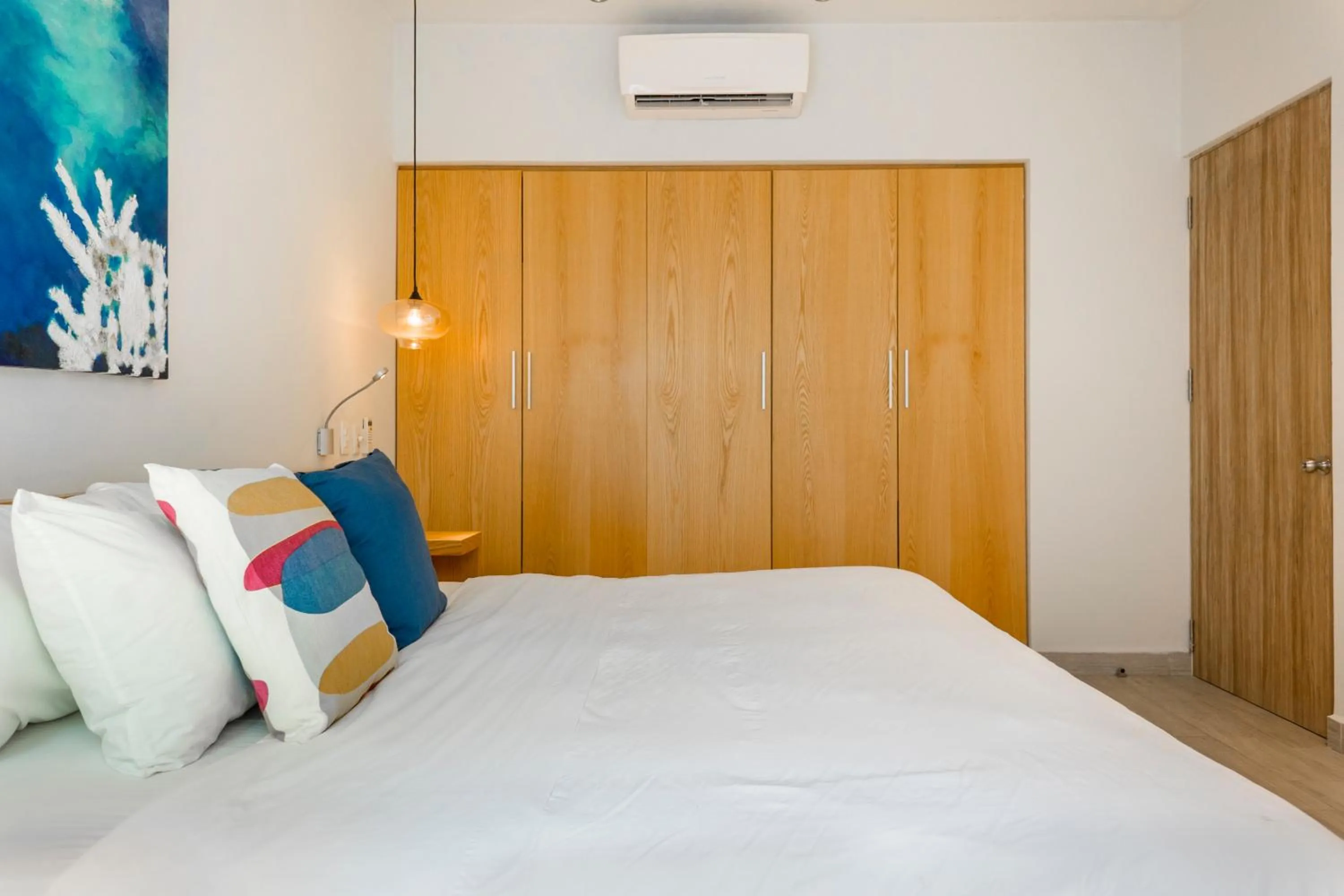 Bed in Opal Suites Apartments