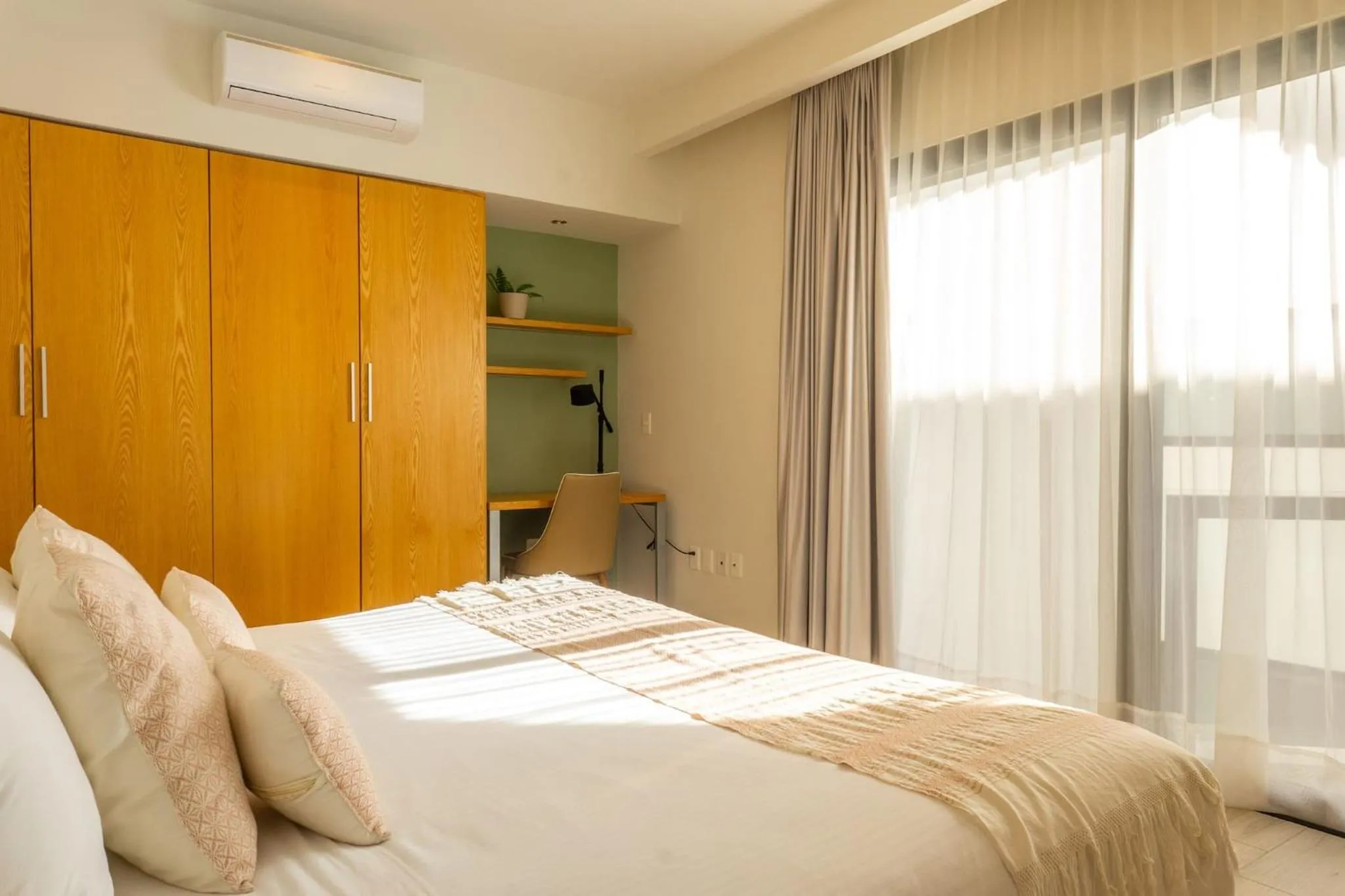 Bed in Opal Suites Apartments