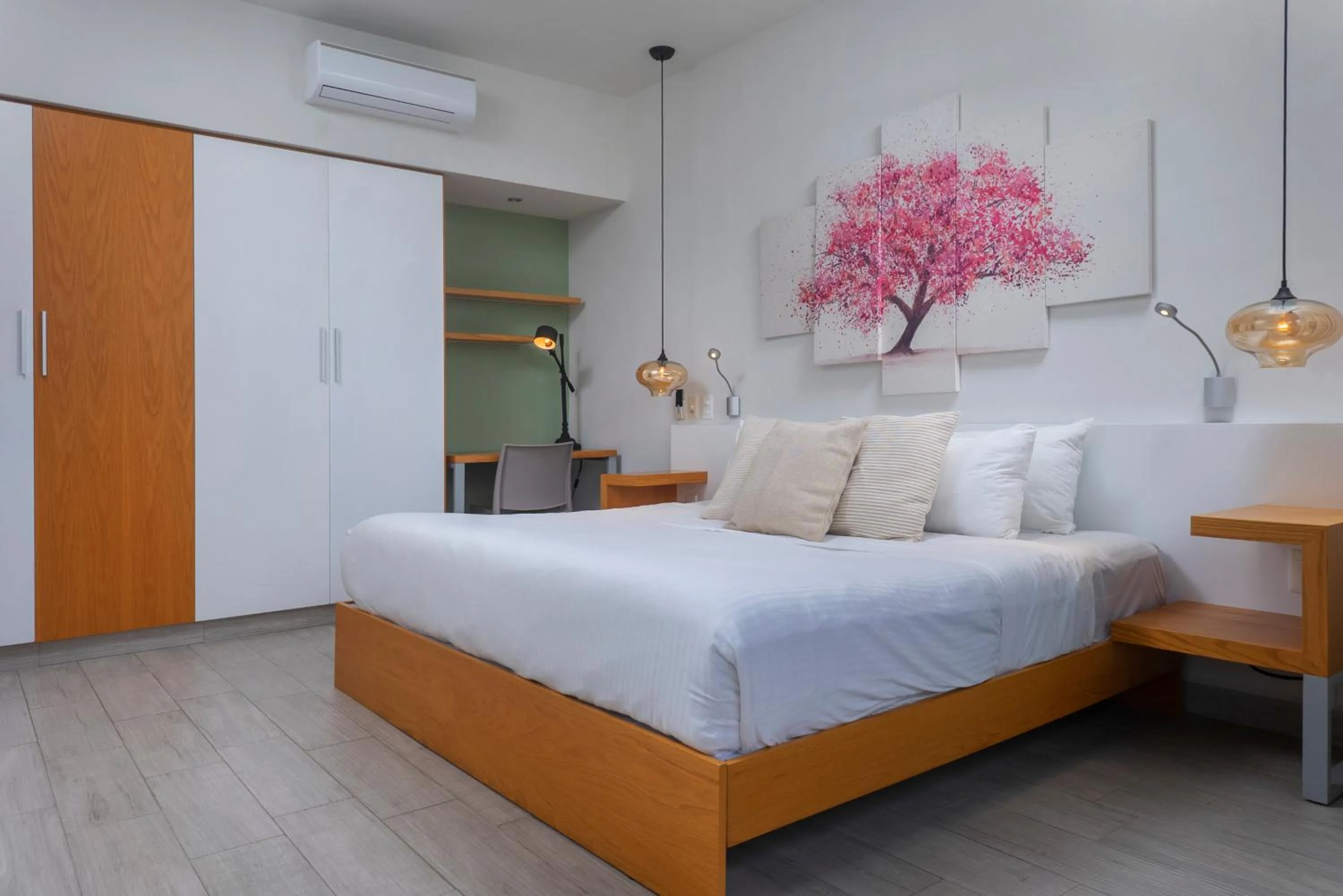 Bed in Opal Suites Apartments