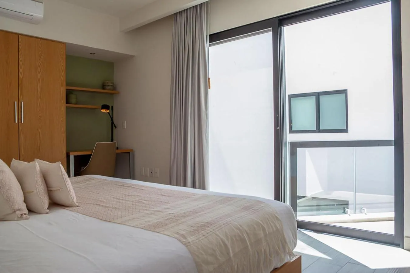 Bed in Opal Suites Apartments