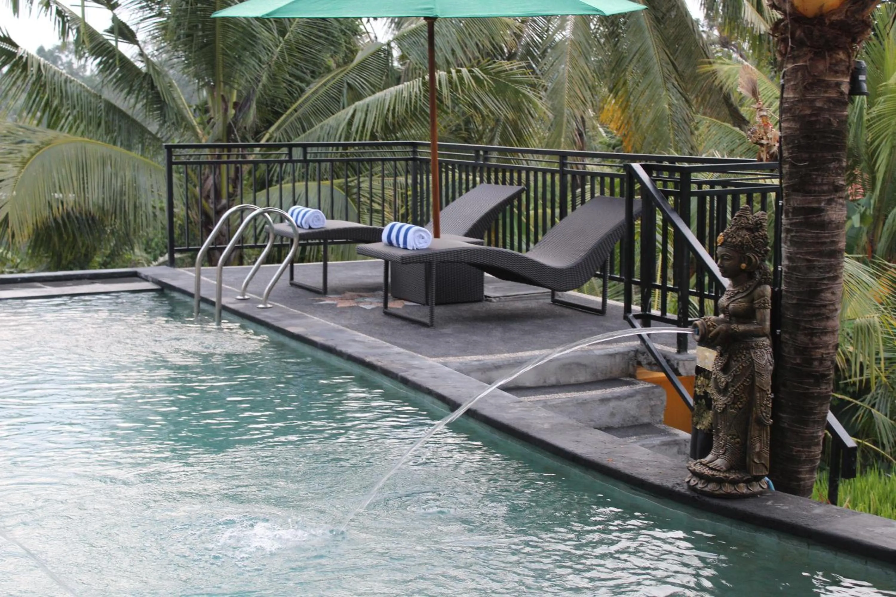 Pool view in Adi Bisma Inn by Mahaputra-CHSE Certified