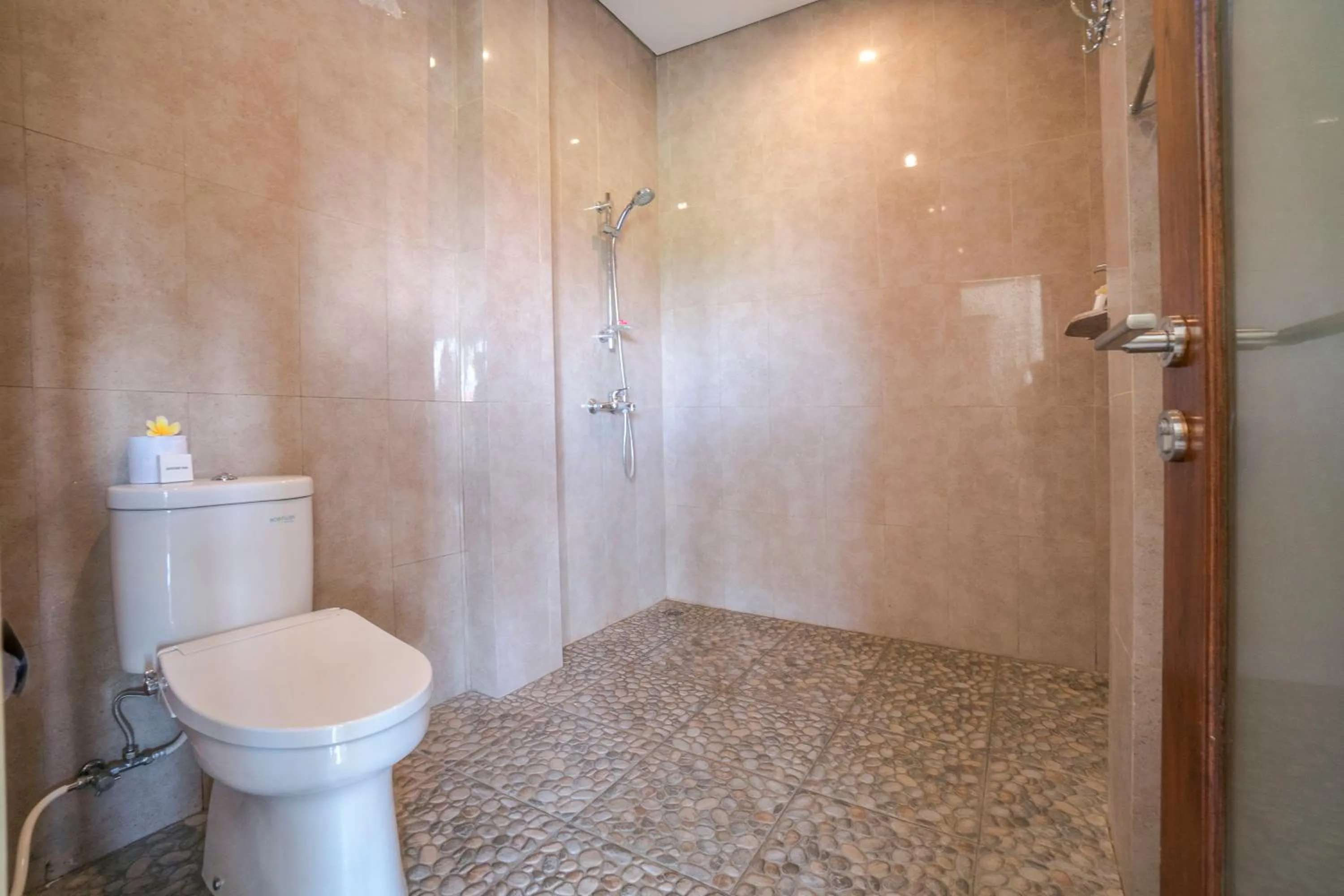 Bathroom in Adi Bisma Inn by Mahaputra-CHSE Certified