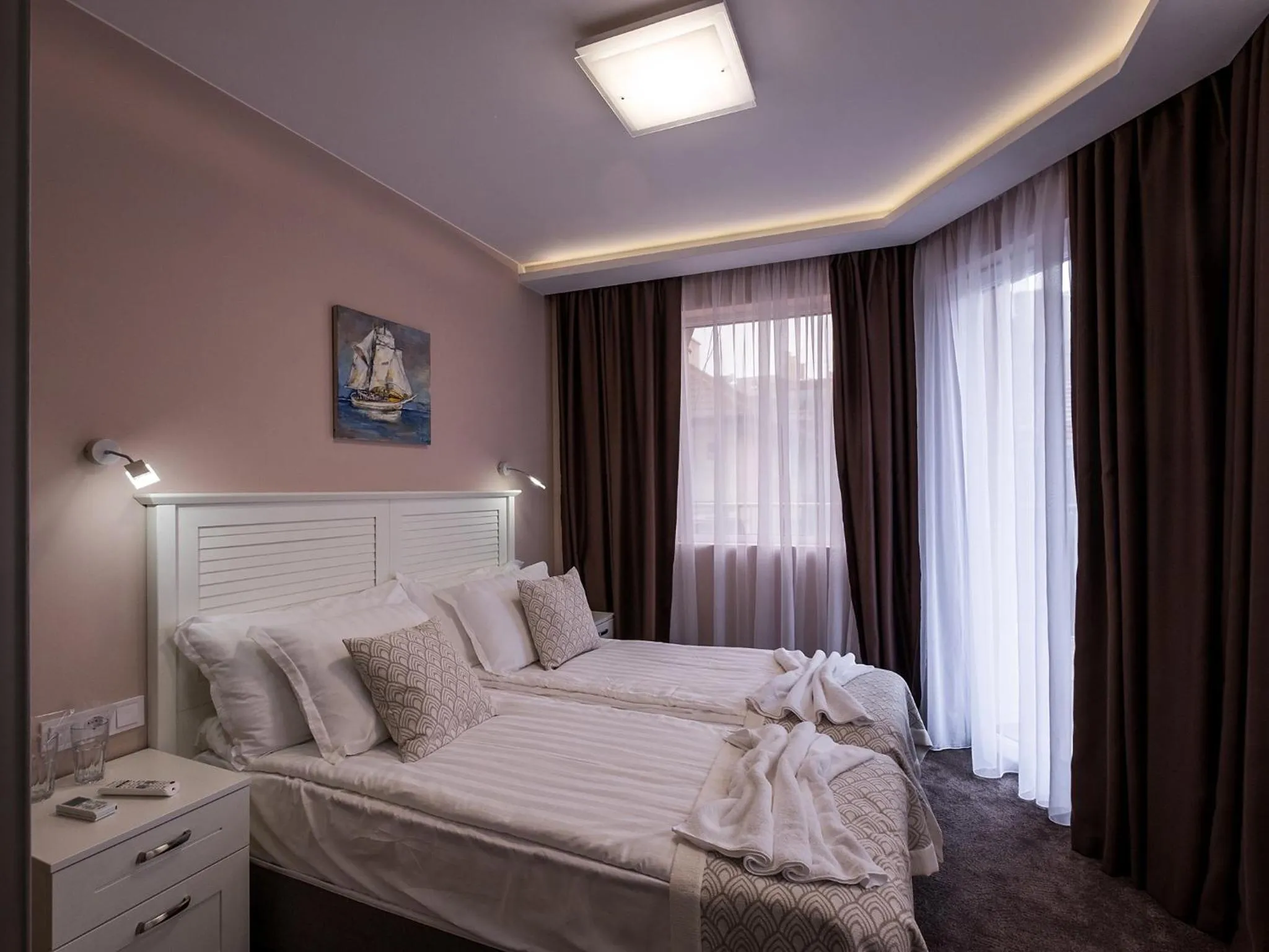 Bed in Caro Apartments & Rooms
