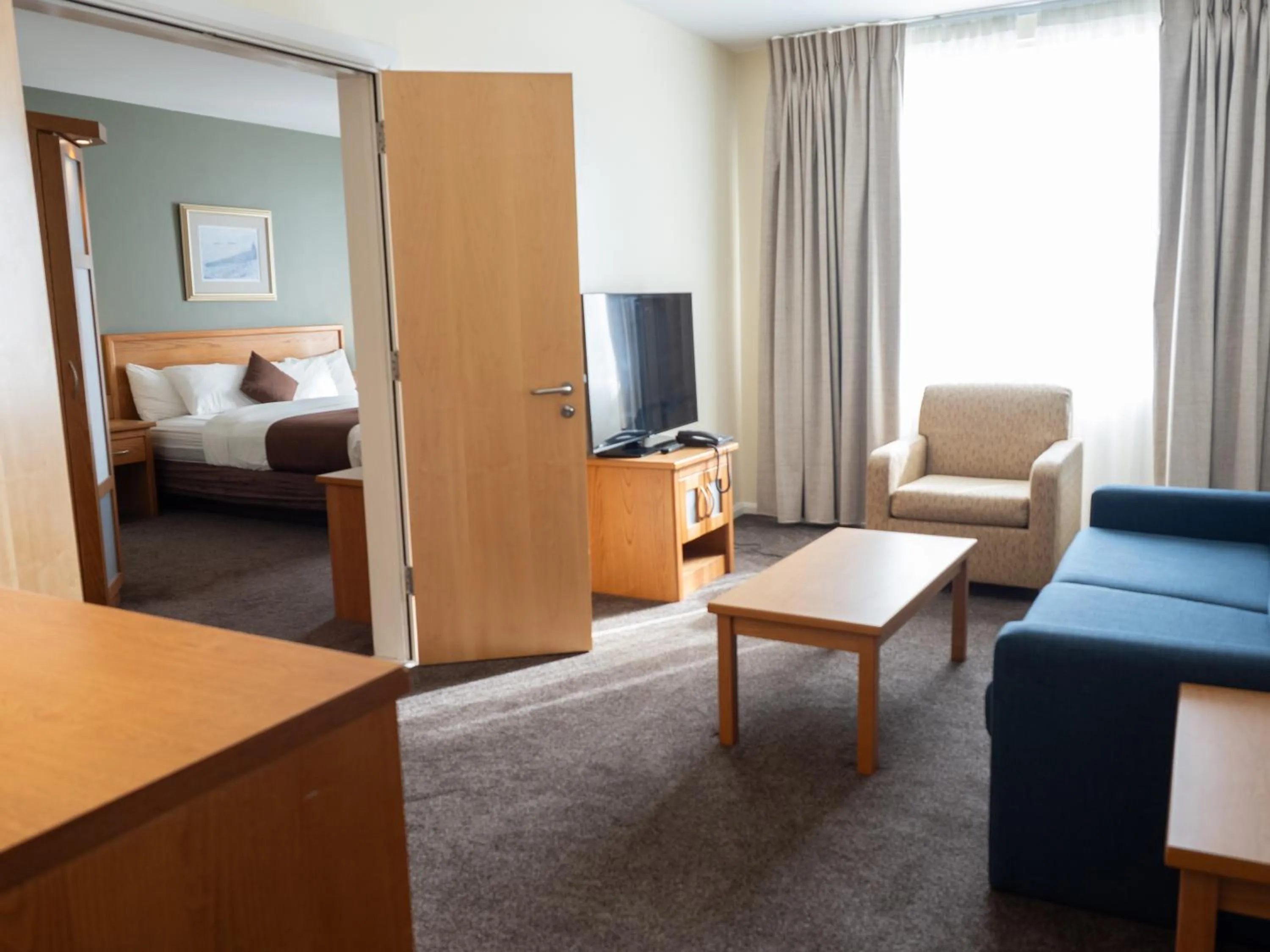 Communal lounge/ TV room, Bed in Future Inn Cardiff Bay