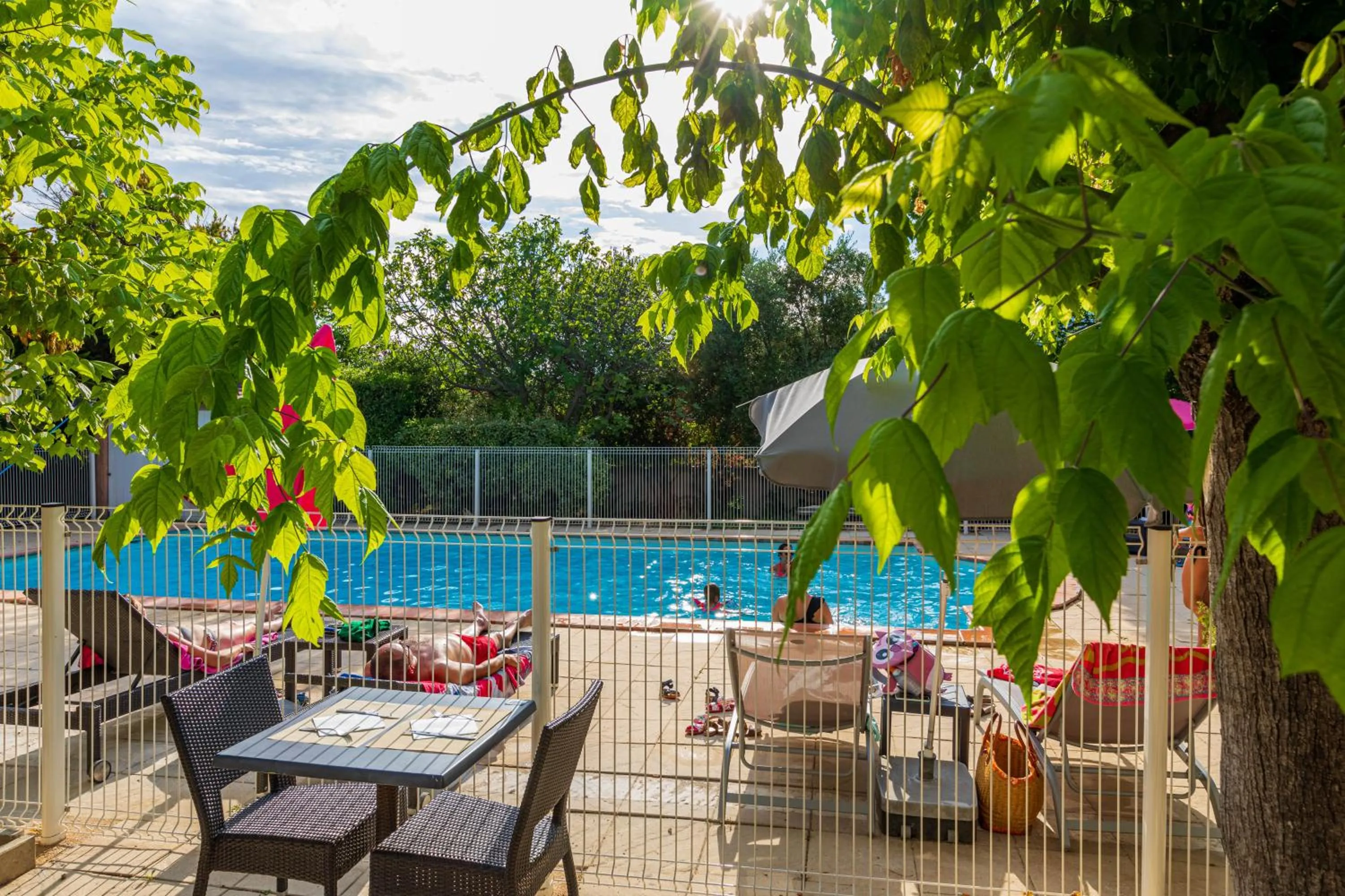Patio in Logis Hotel Noemys pont de l'Etoile