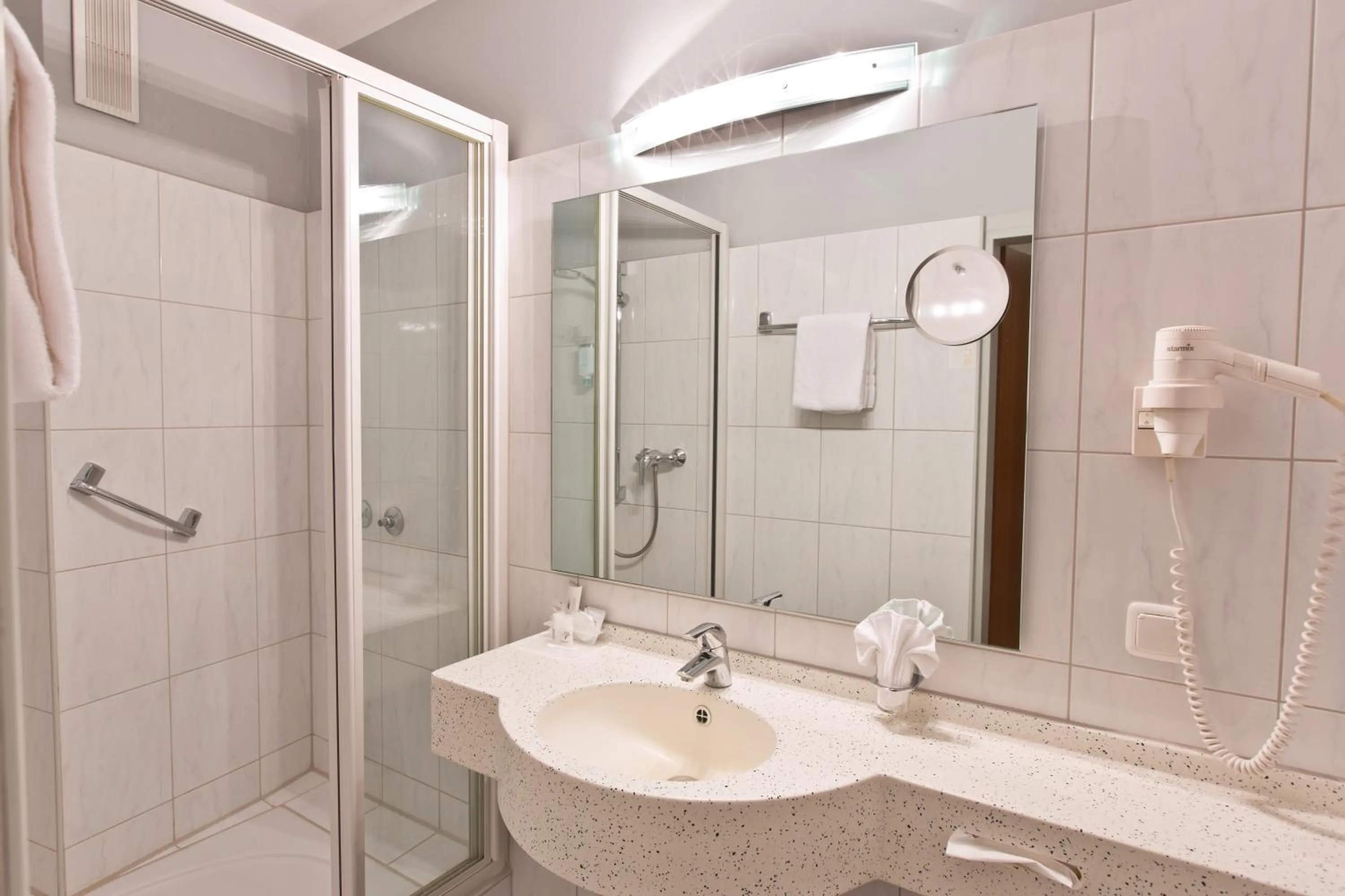 Bathroom in Astor & Aparthotel