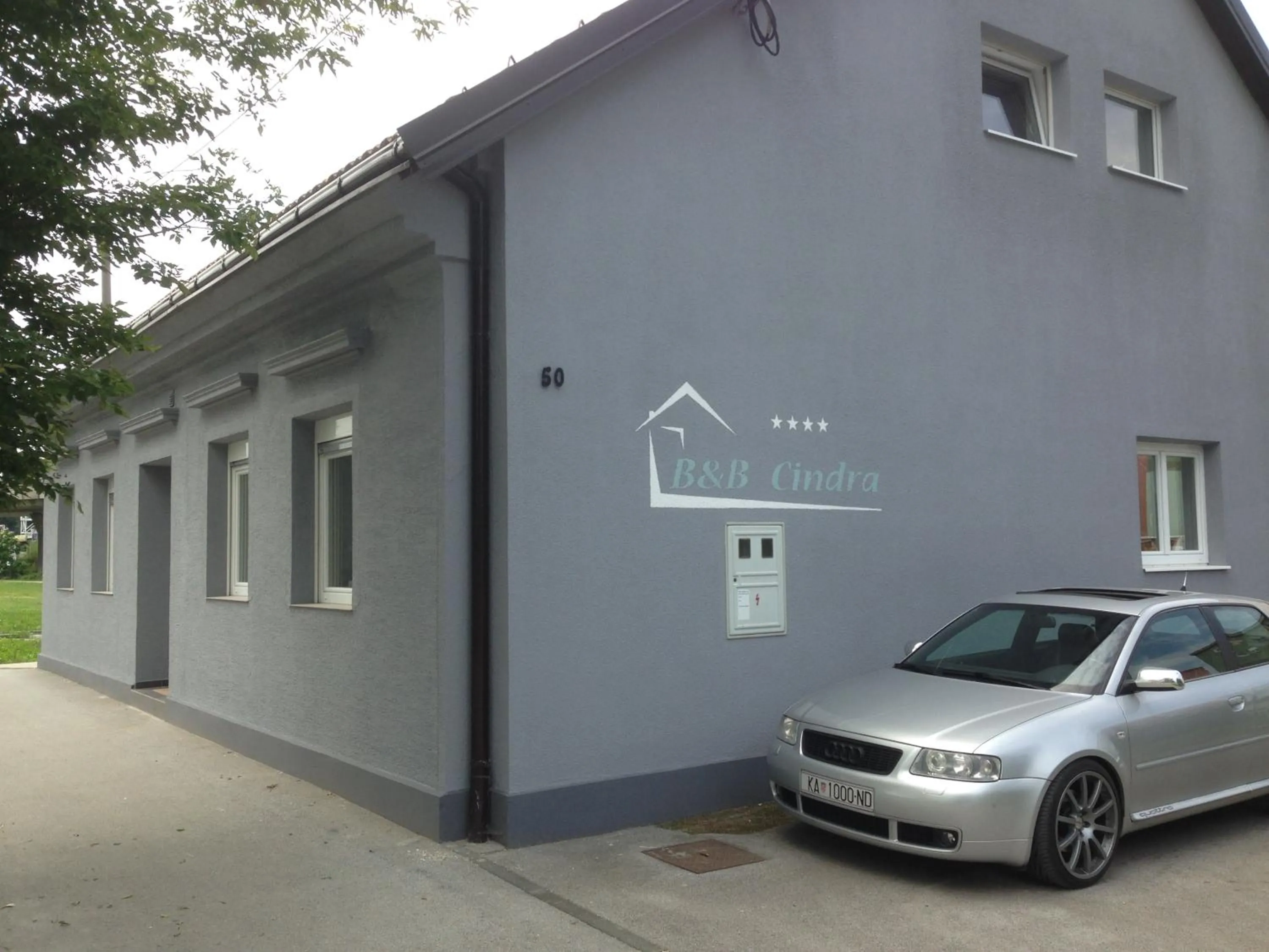 Property logo or sign in Apartments Cindra