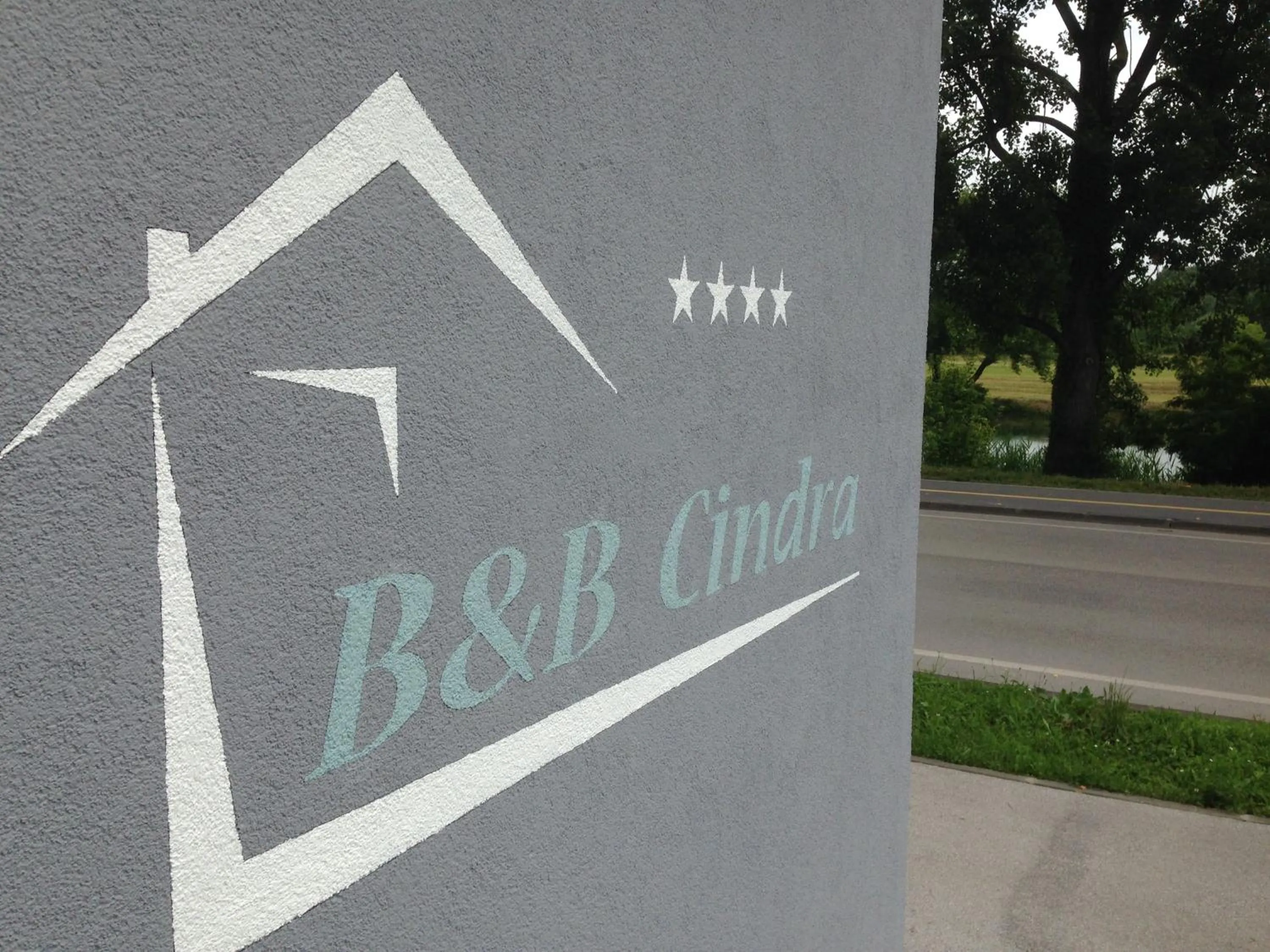Property logo or sign in Apartments Cindra