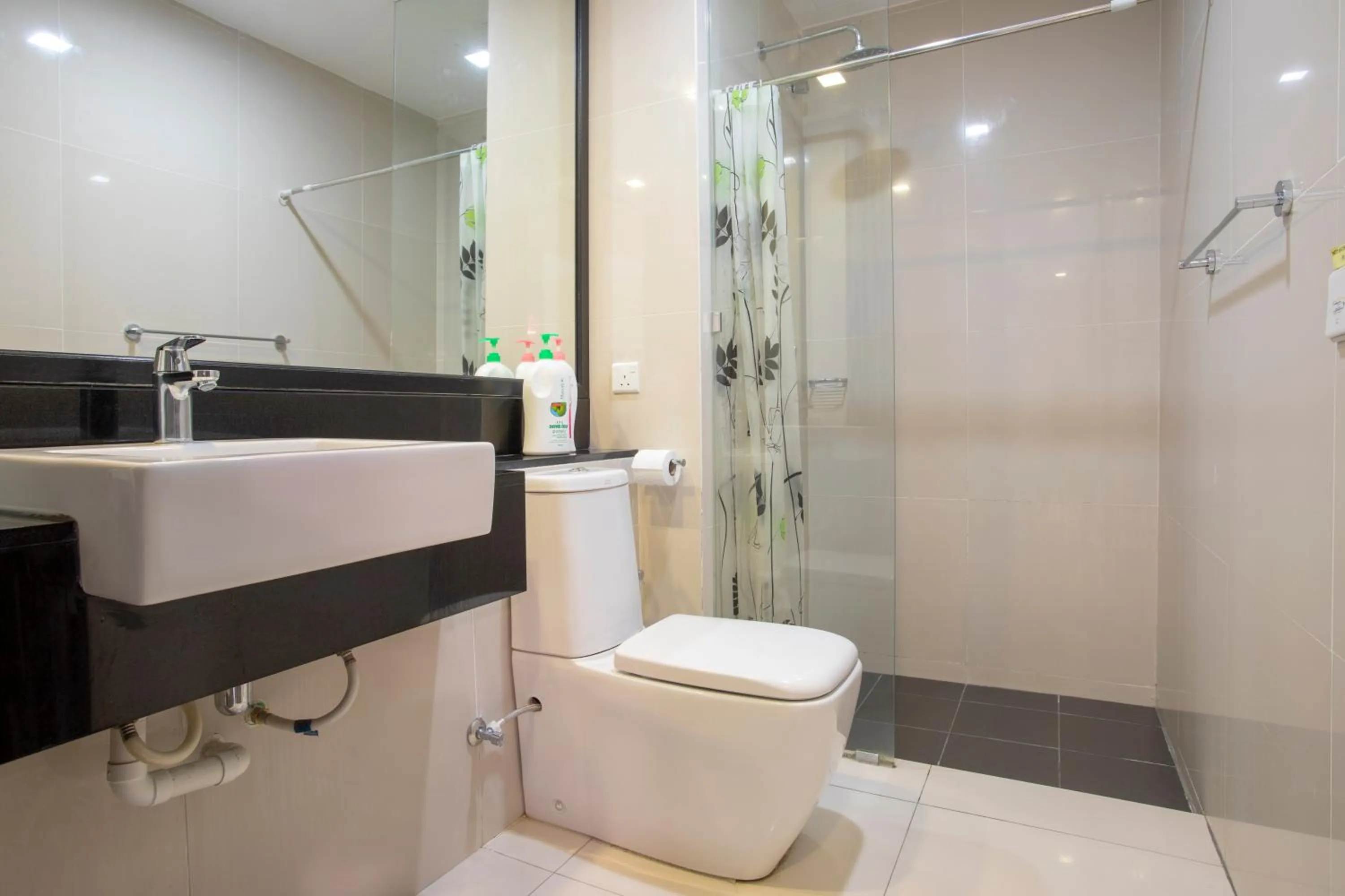 Shower in Cozy Living Sky Apartment