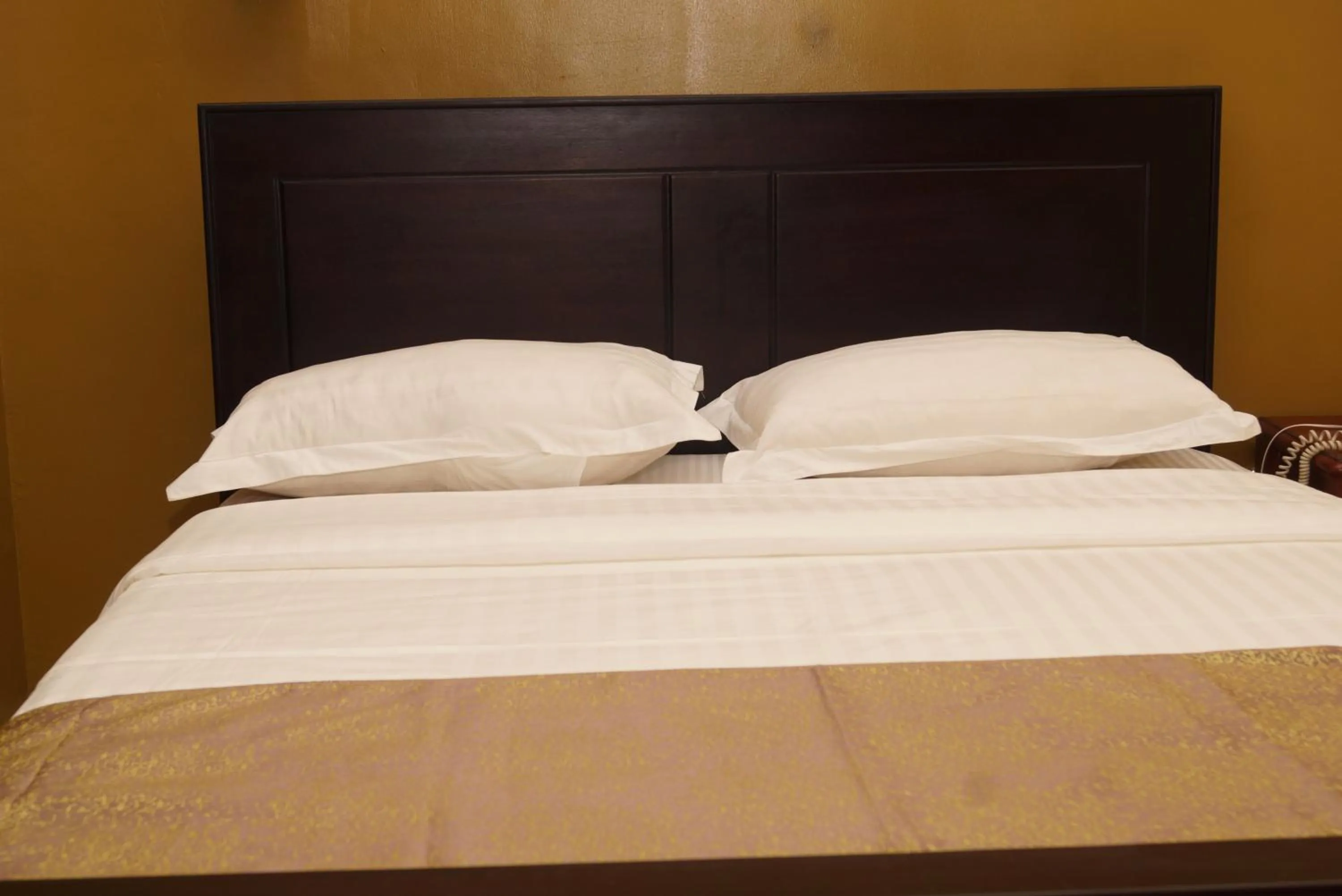 Bed in Diamonds Hotel Kampala