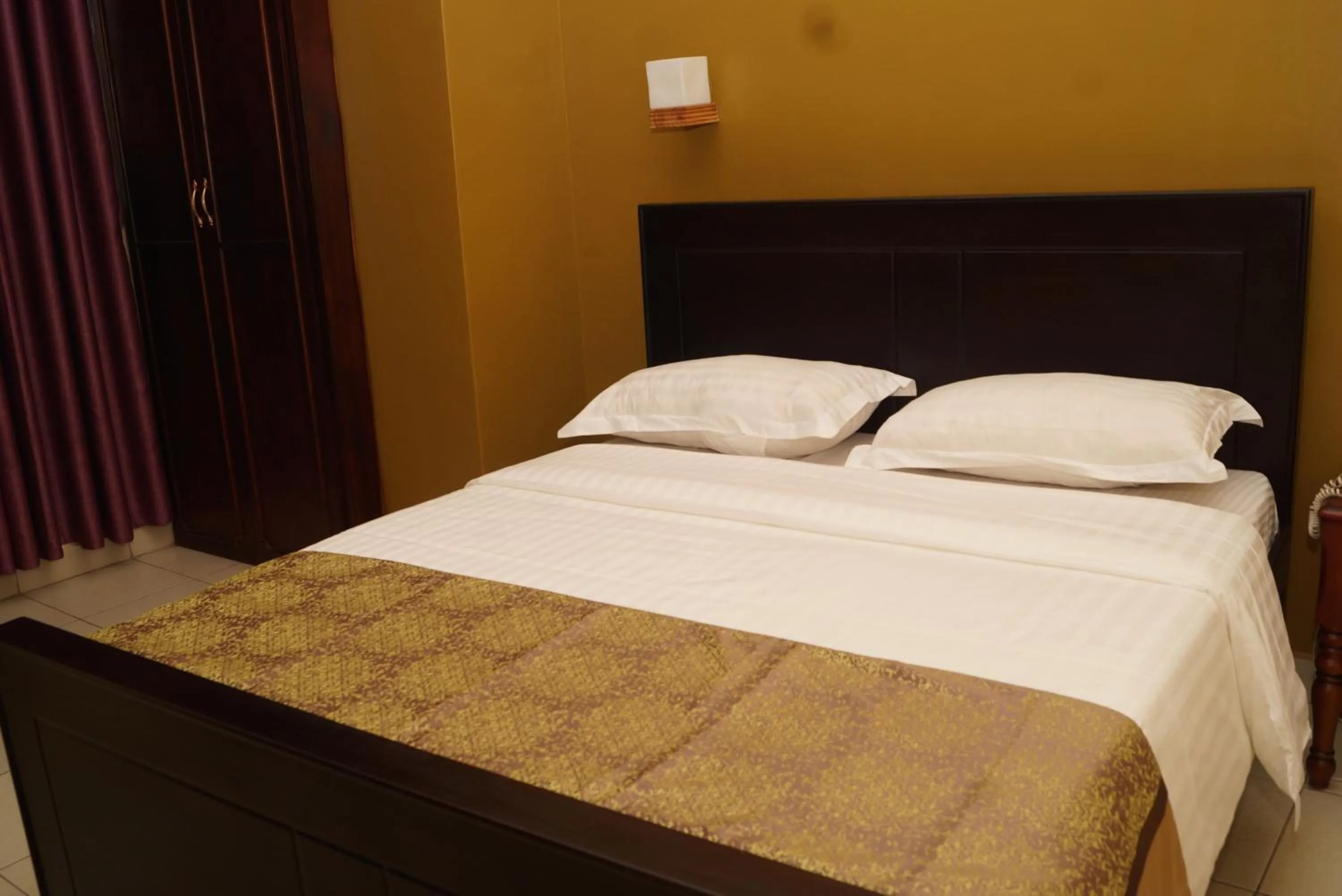 Bed in Diamonds Hotel Kampala