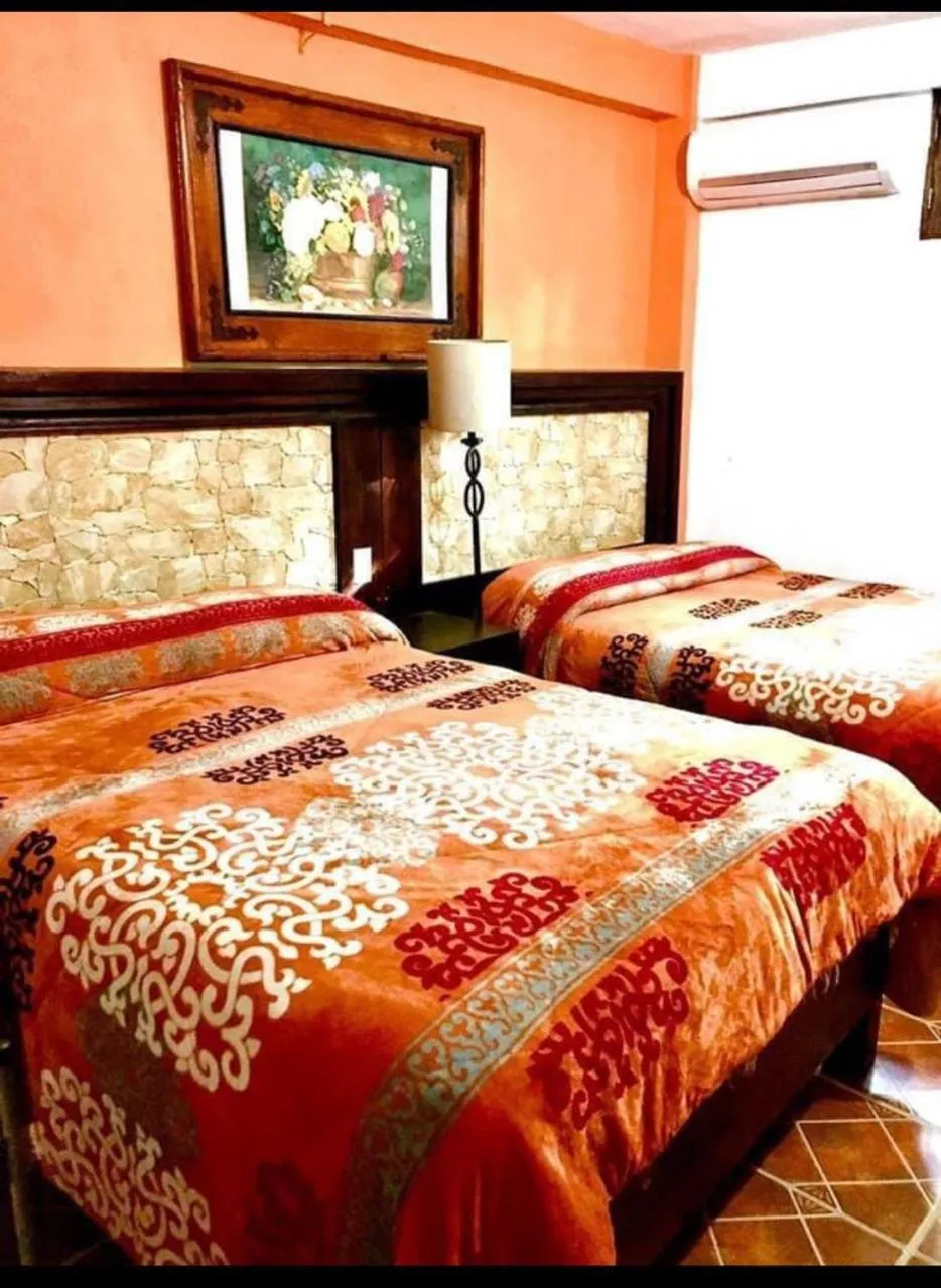 Bed in Hotel Posada San Agustin