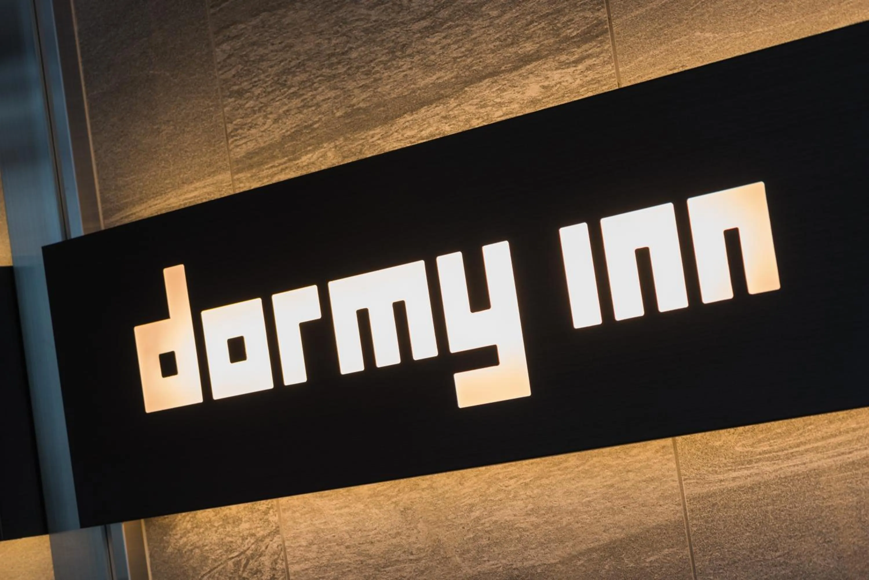 Property logo or sign in Dormy Inn EXPRESS Sendai Seaside