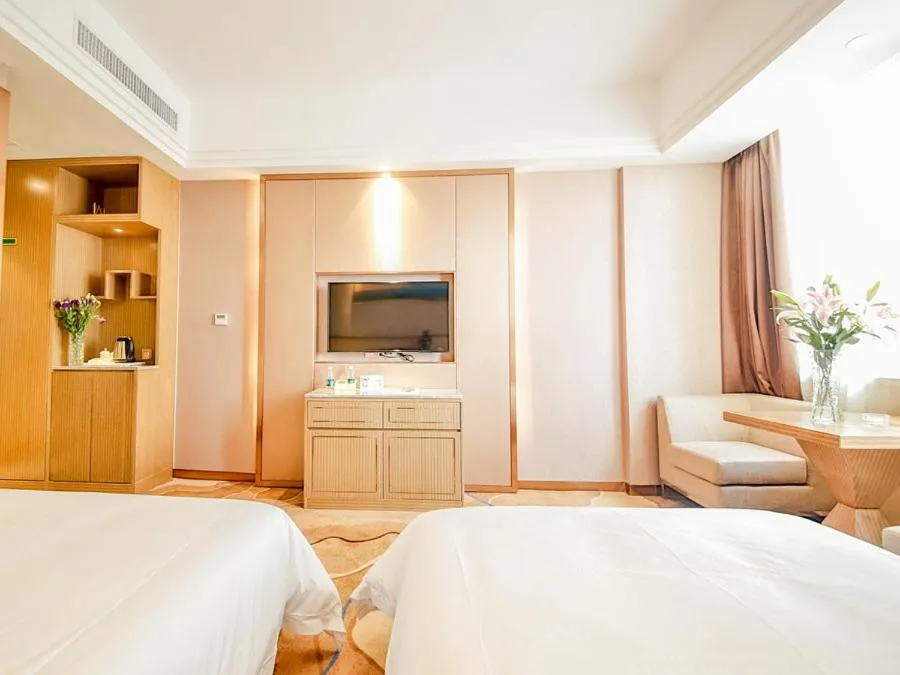 Bed in Vienna International Hotel Huhan Jiedaokou