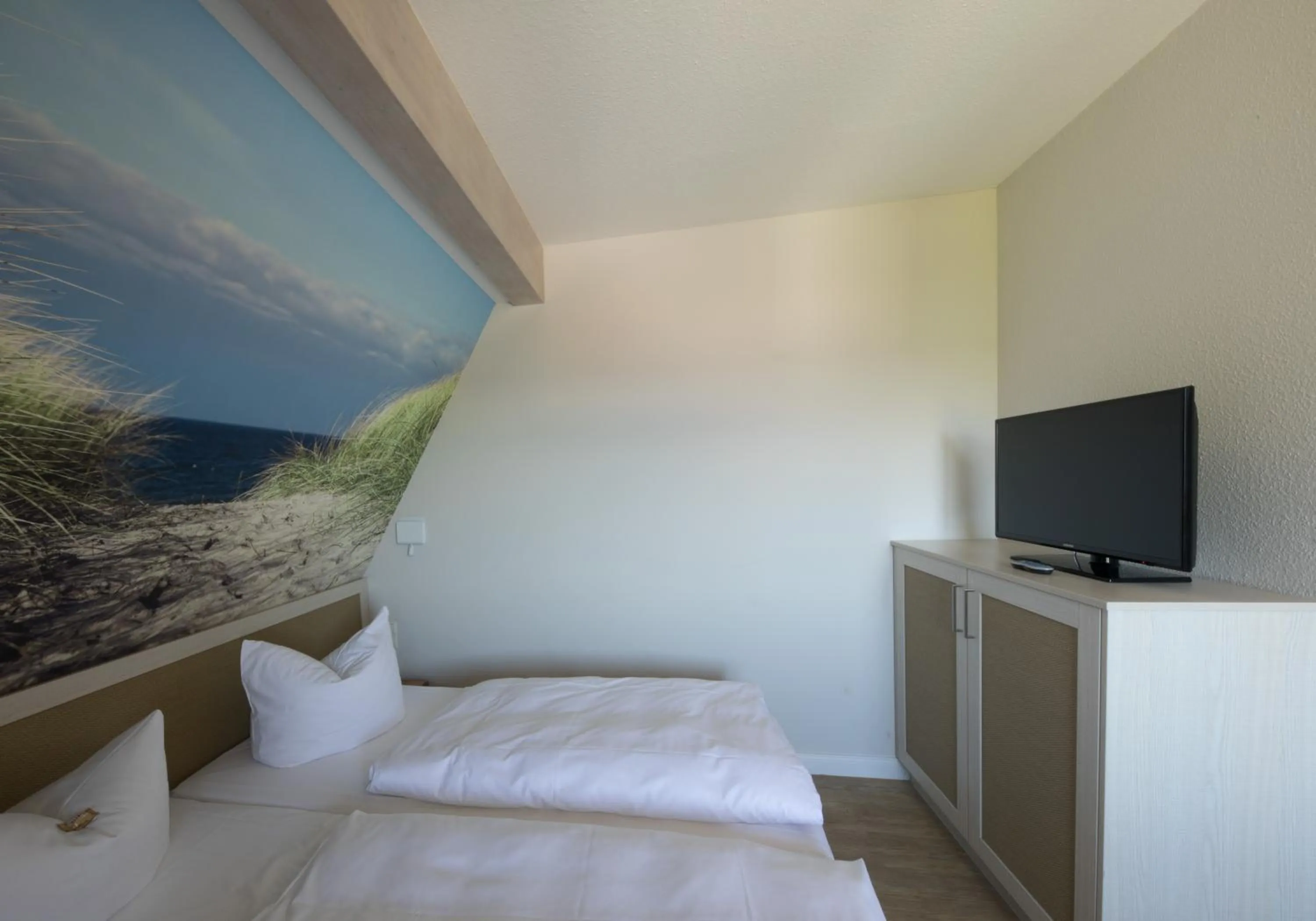 Photo of the whole room, Bed in Hotel Haus am Meer